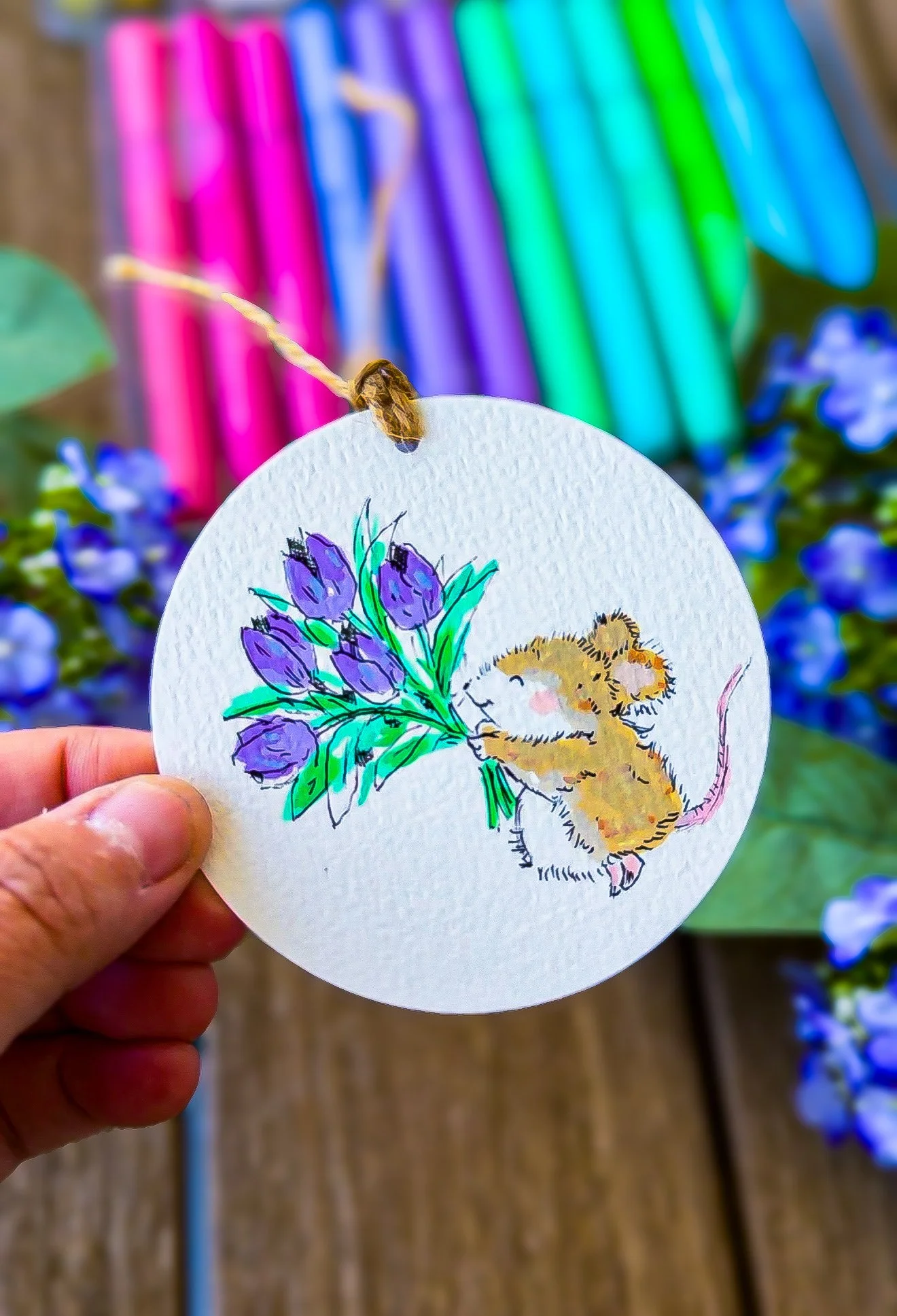 A sweet marker illustration of a mouse with tulips
