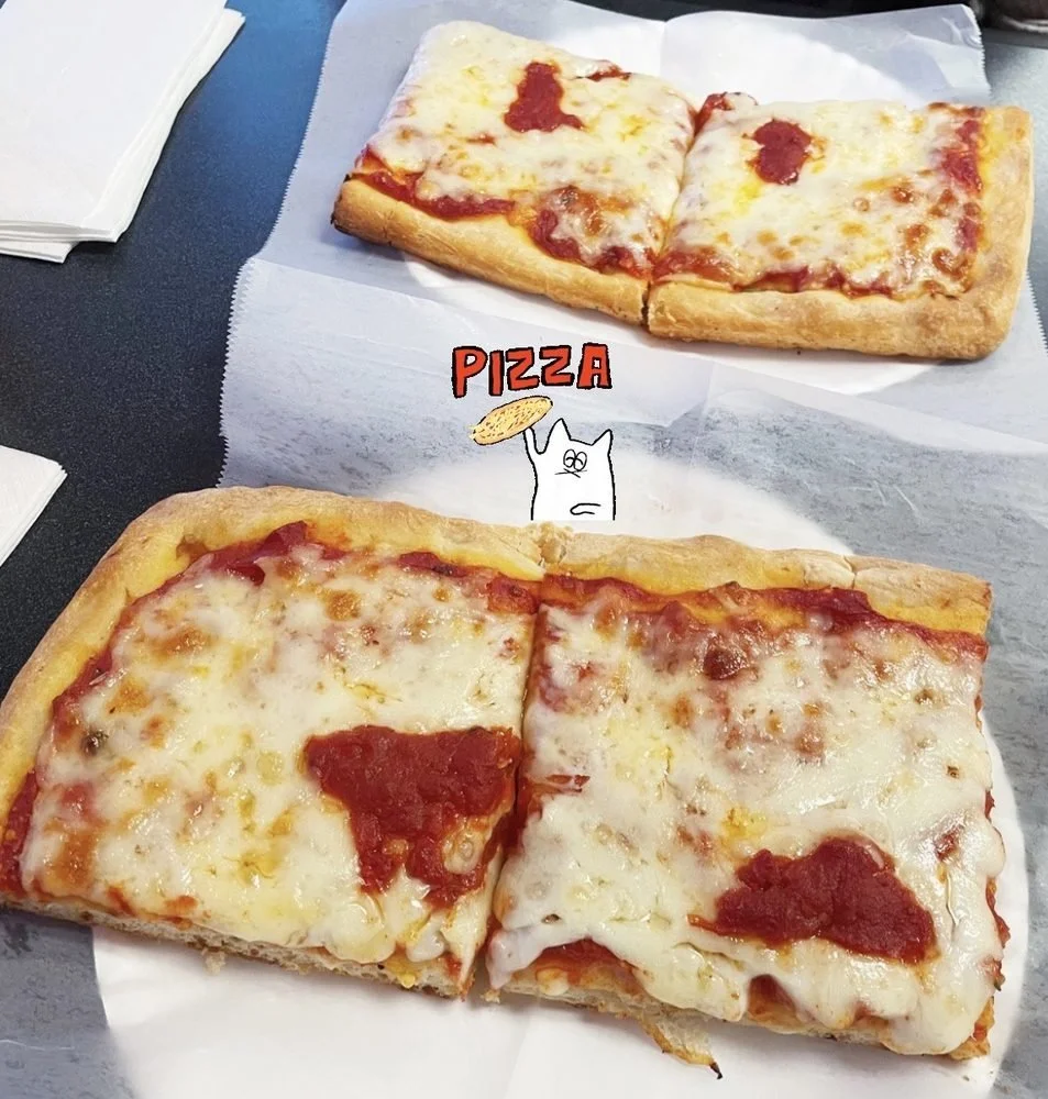 Two slices of cheese pizza with tomato sauce on a paper-lined tray.