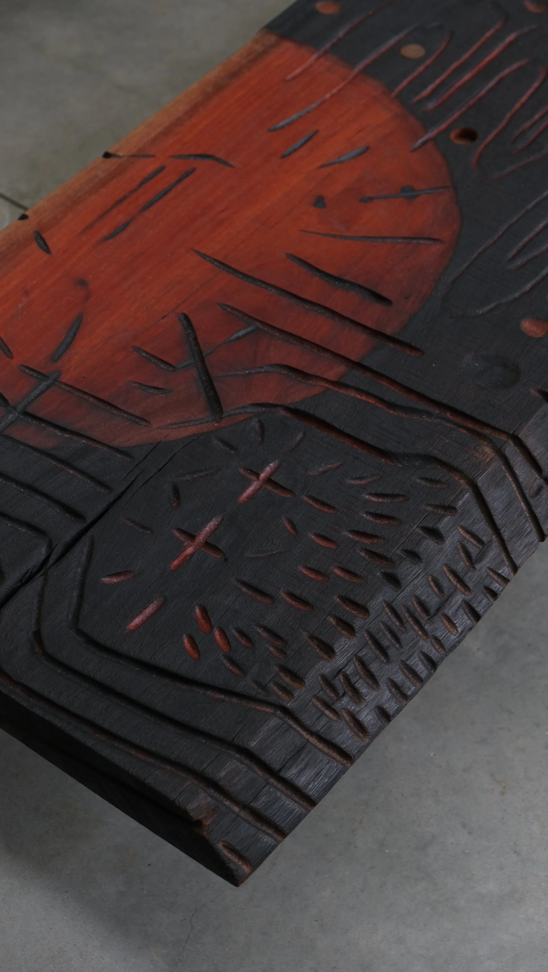 Reclaimed Blue Gum Shou Sugi Ban ceremonial table with carved symbols and red pigment — Kitsune Moon Byron Bay