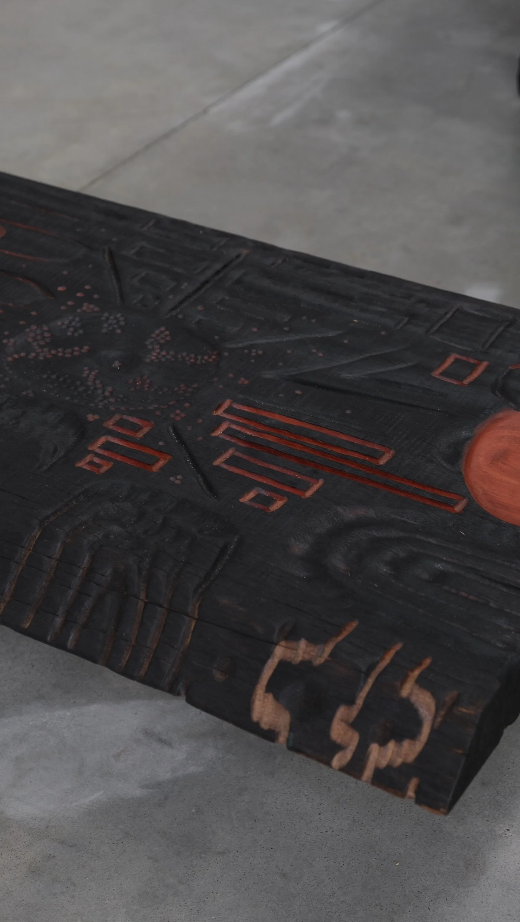 Reclaimed Blue Gum Shou Sugi Ban ceremonial table with carved symbols and red pigment — Kitsune Moon Byron Bay