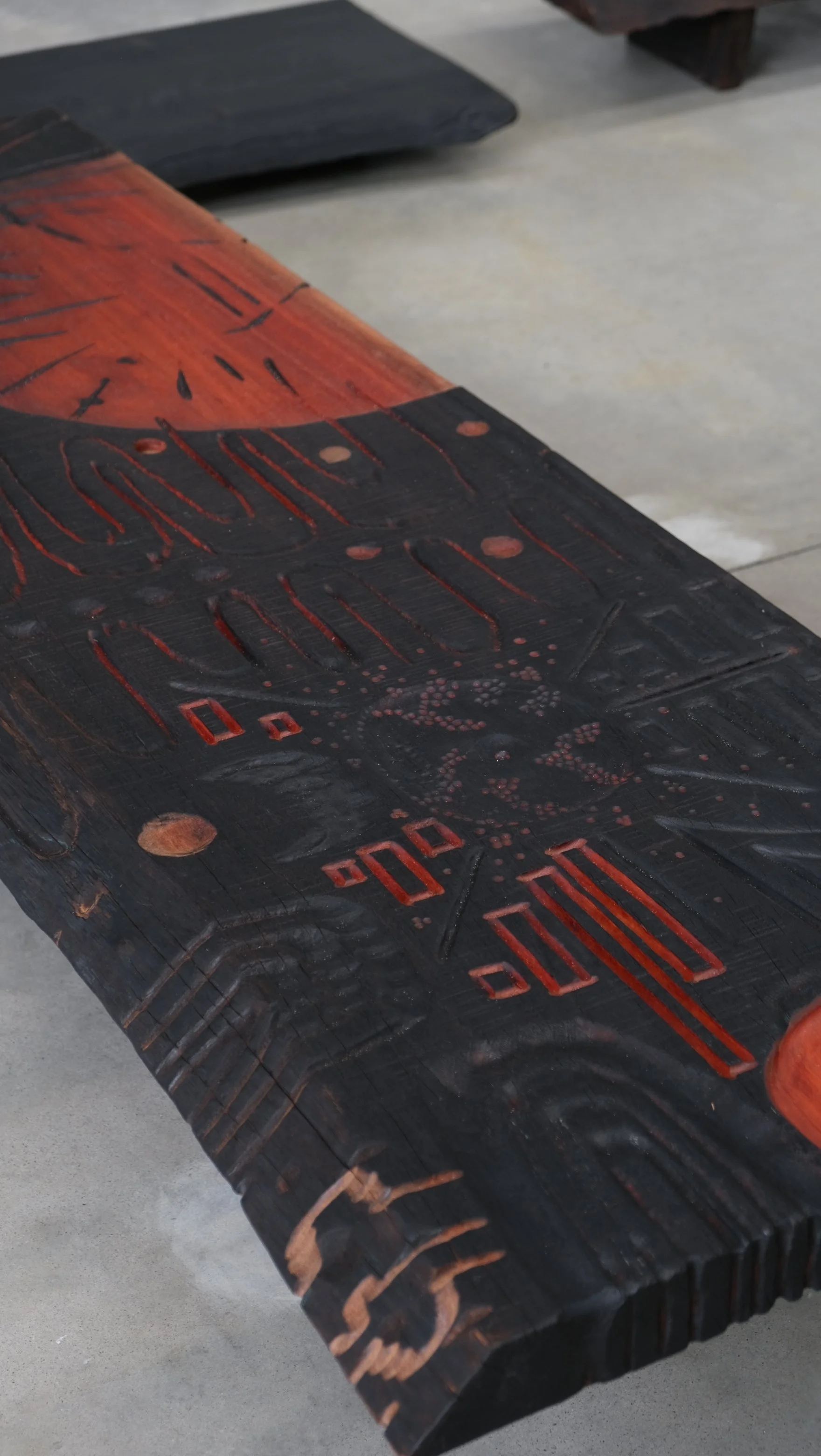 Reclaimed Blue Gum Shou Sugi Ban ceremonial table with carved symbols and red pigment — Kitsune Moon Byron Bay