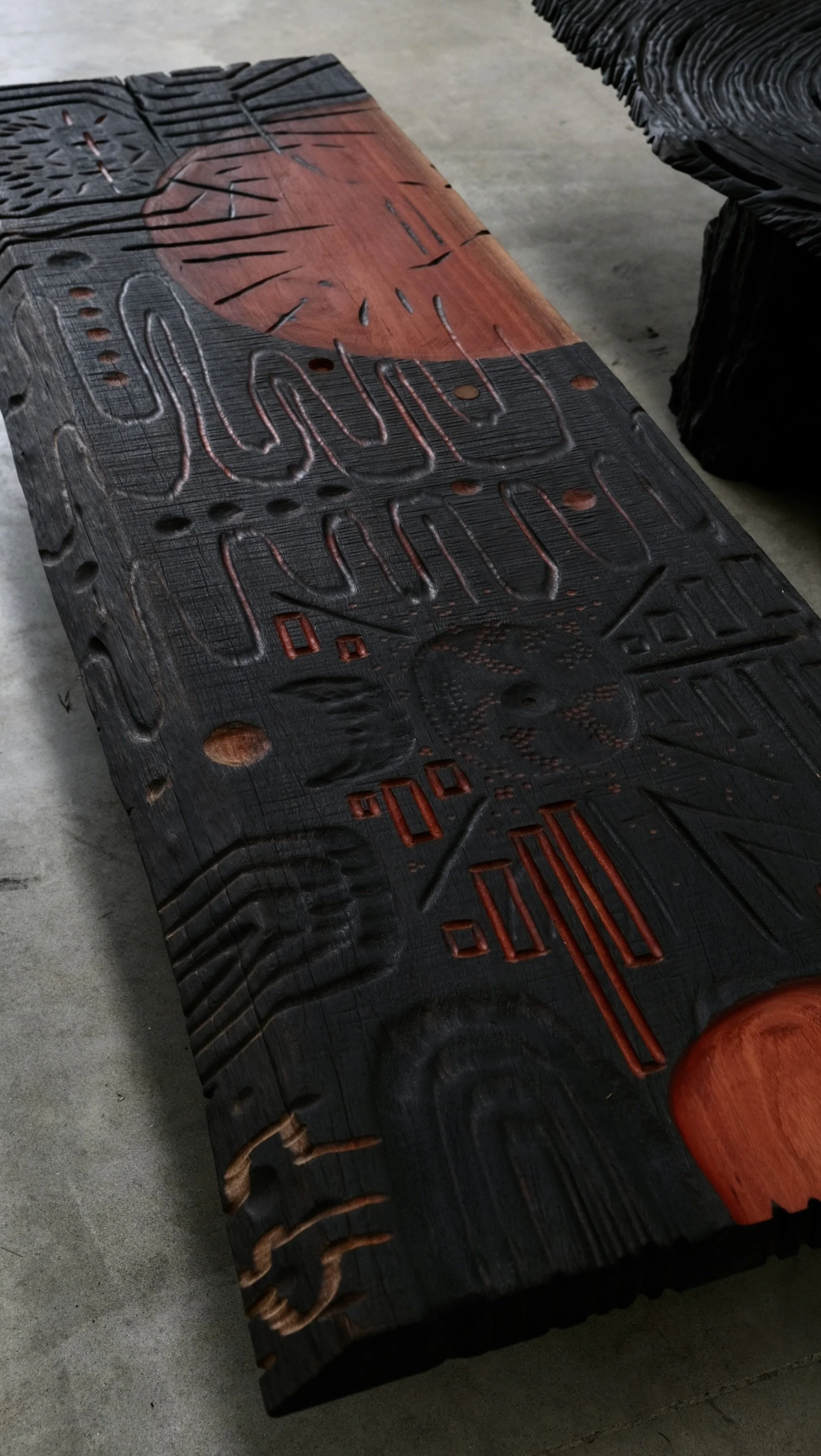 Reclaimed Blue Gum Shou Sugi Ban ceremonial table with carved symbols and red pigment — Kitsune Moon Byron Bay