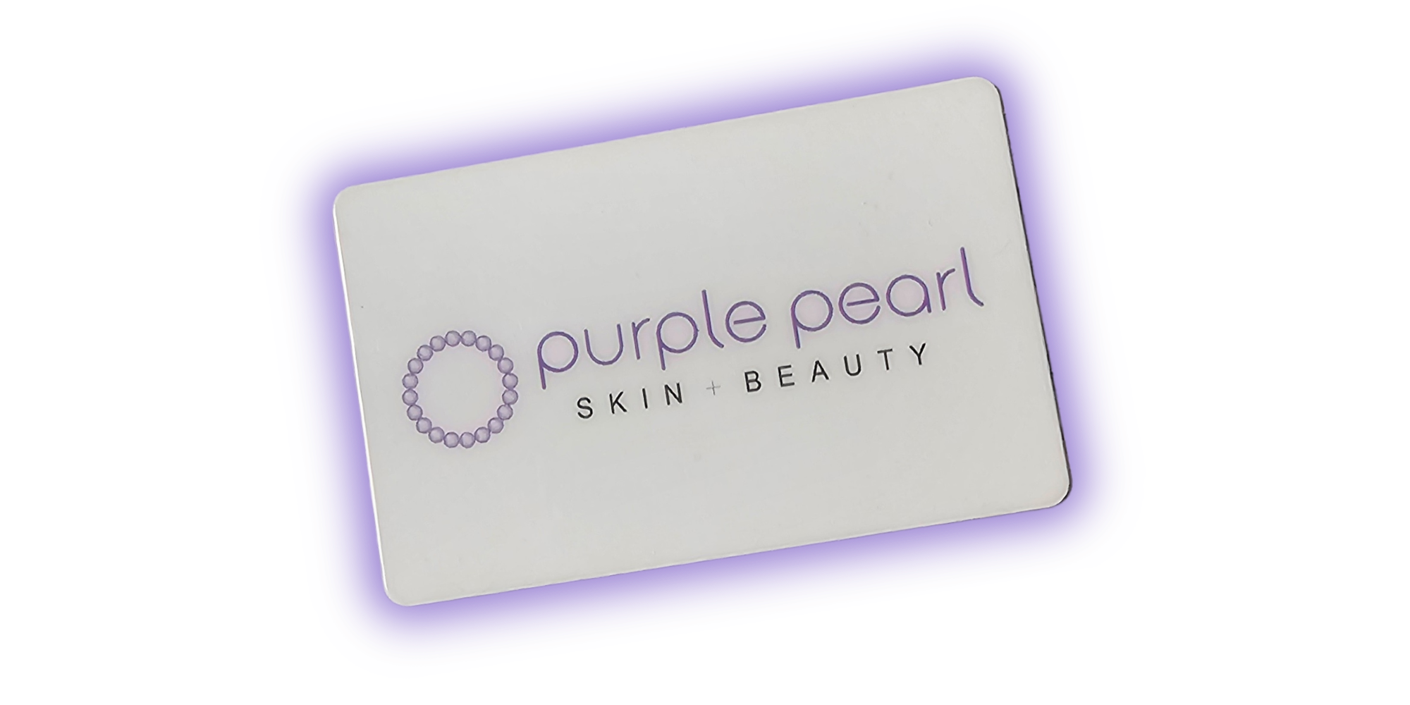Close-up of a product package with text 'purple pearl skin + beauty' and a circular pearl design on a white background with purple border.