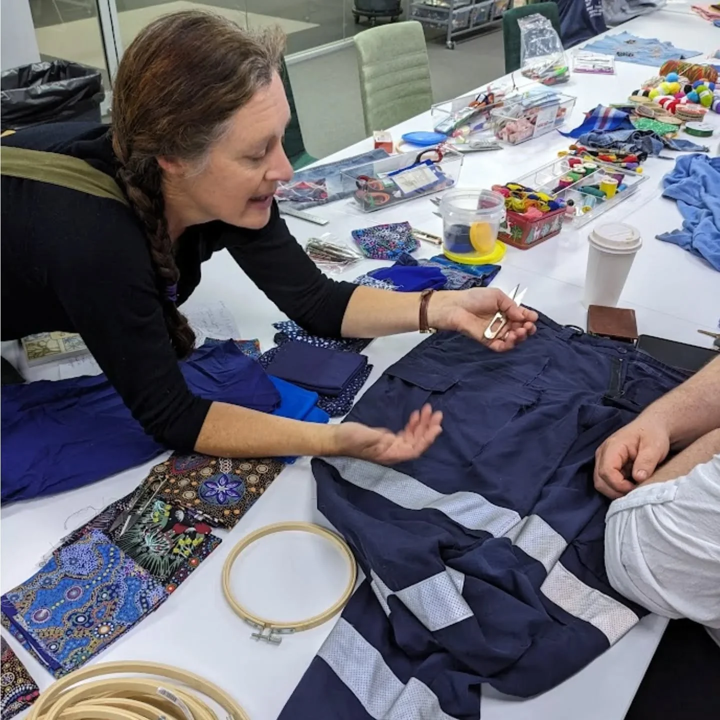 Visible mending at the Armidale Regional library last Saturday, with the brilliant Thread Shed volunteers Kait (above) and Narelle (not pictured). Garments were kept from landfill, ready to live another day, and creativity won the day. 
There will be