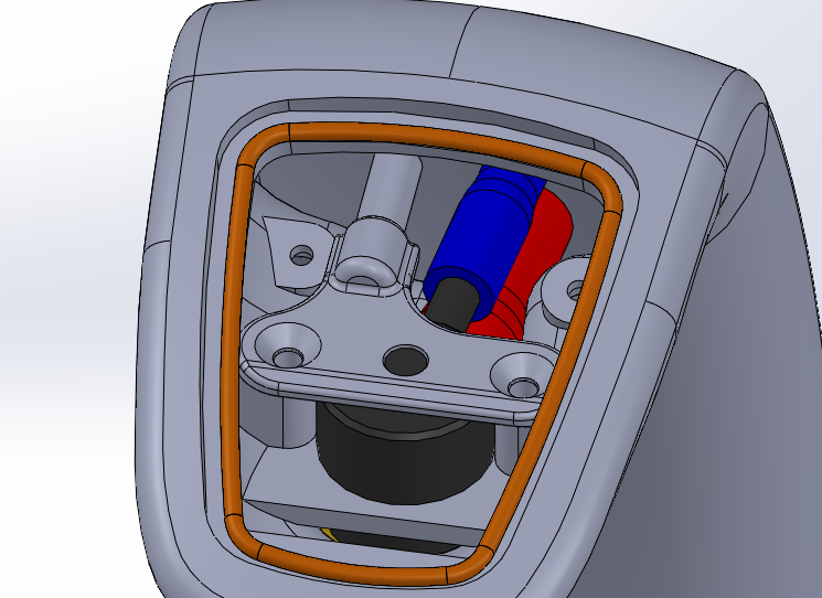 A 3D rendering of a mechanical device, possibly a pump or valve, with internal components including a blue and red cylindrical part, a black circular base, and an orange gasket surrounding the interior opening.