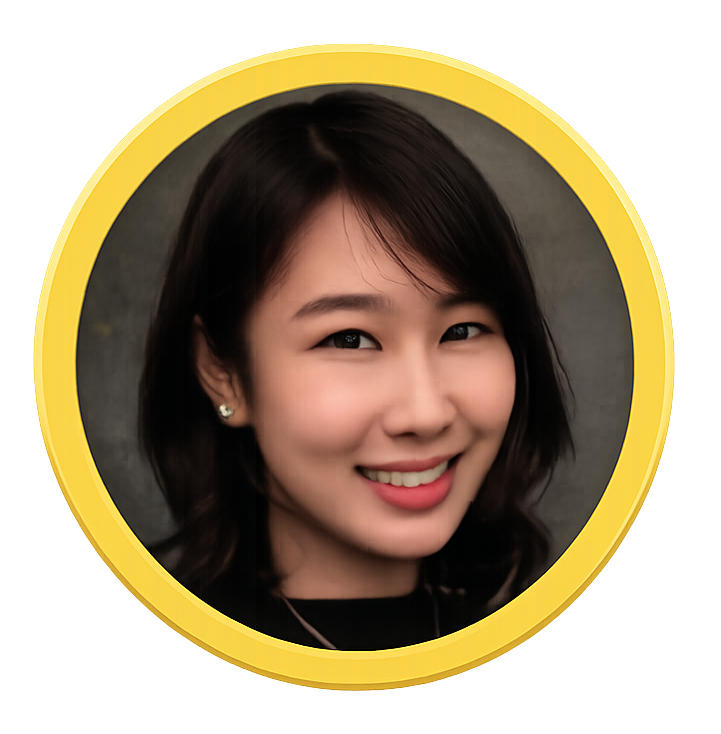 Directors of Sleepy Bear Group. A young woman smiling, with shoulder-length dark hair, wearing earrings and a dark top, framed by a yellow circular border.