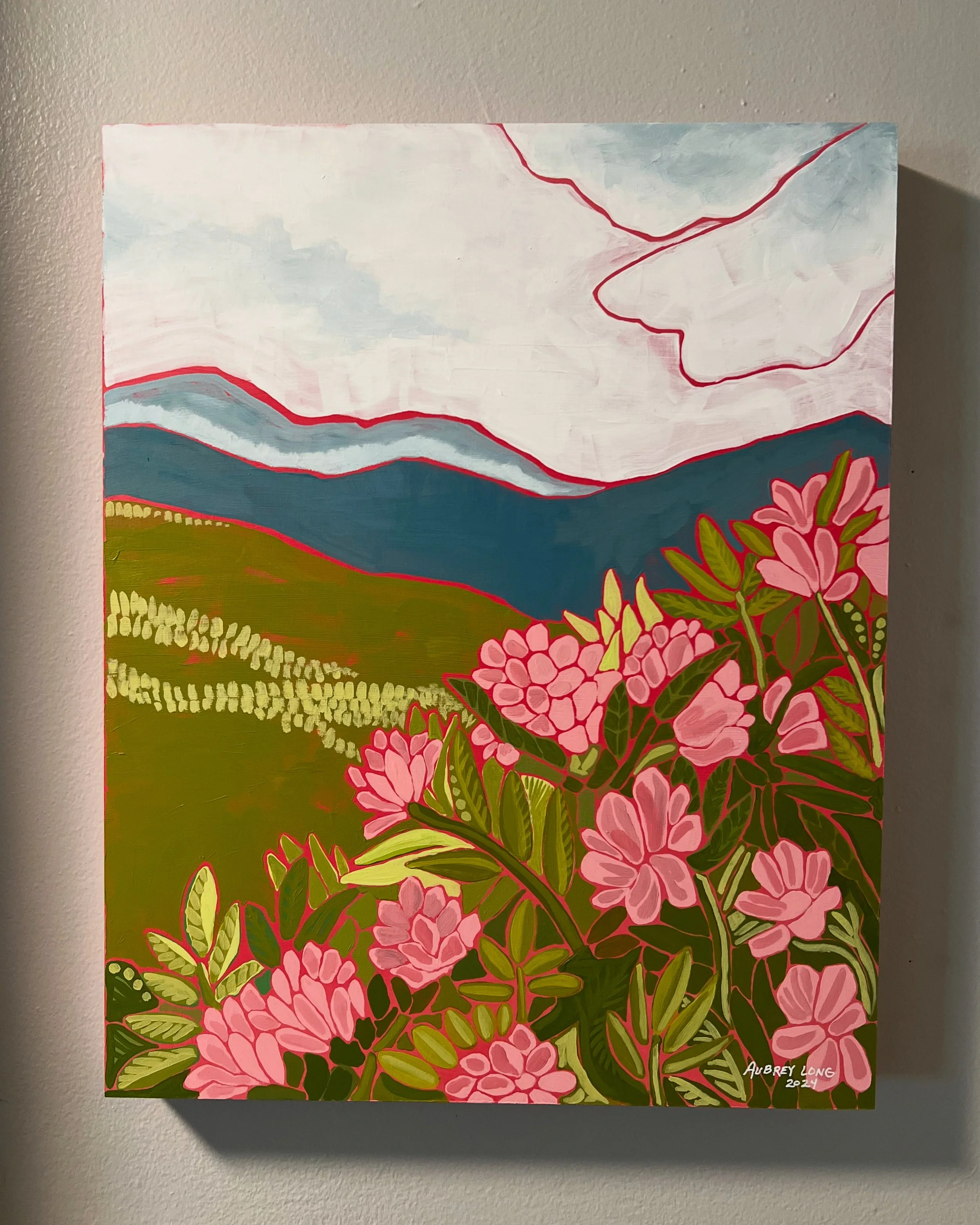 A colorful painting of a landscape with pink flowers in the foreground, rolling green hills, blue mountains, and a cloudy sky.