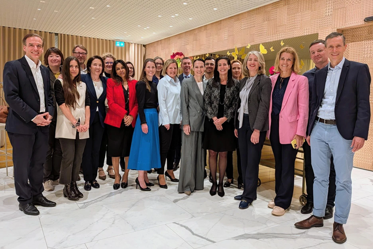 Participants posing in a group photo at a CHRO event.