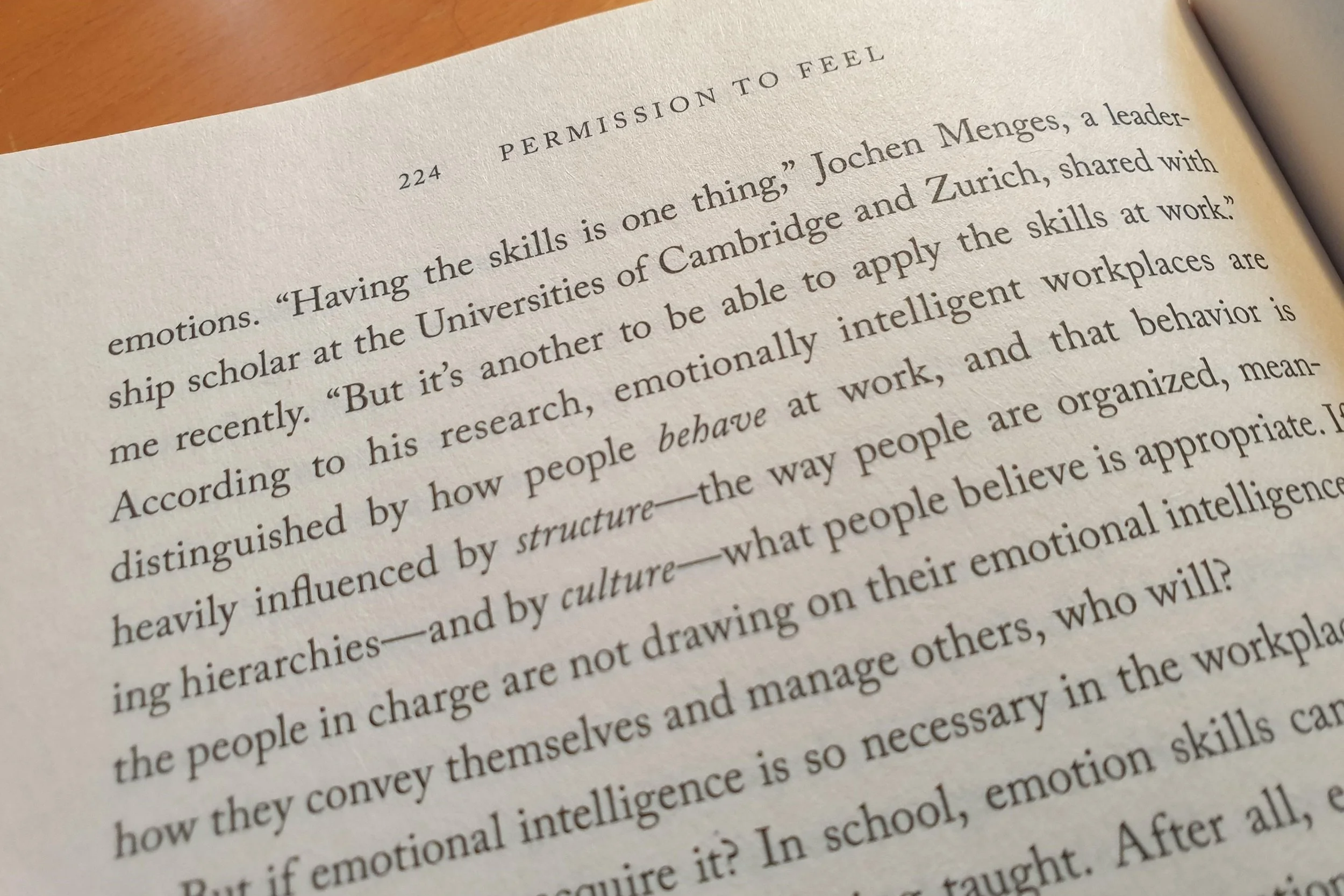 Close-up of a book page discussing emotional intelligence and emotionally intelligent workplaces.