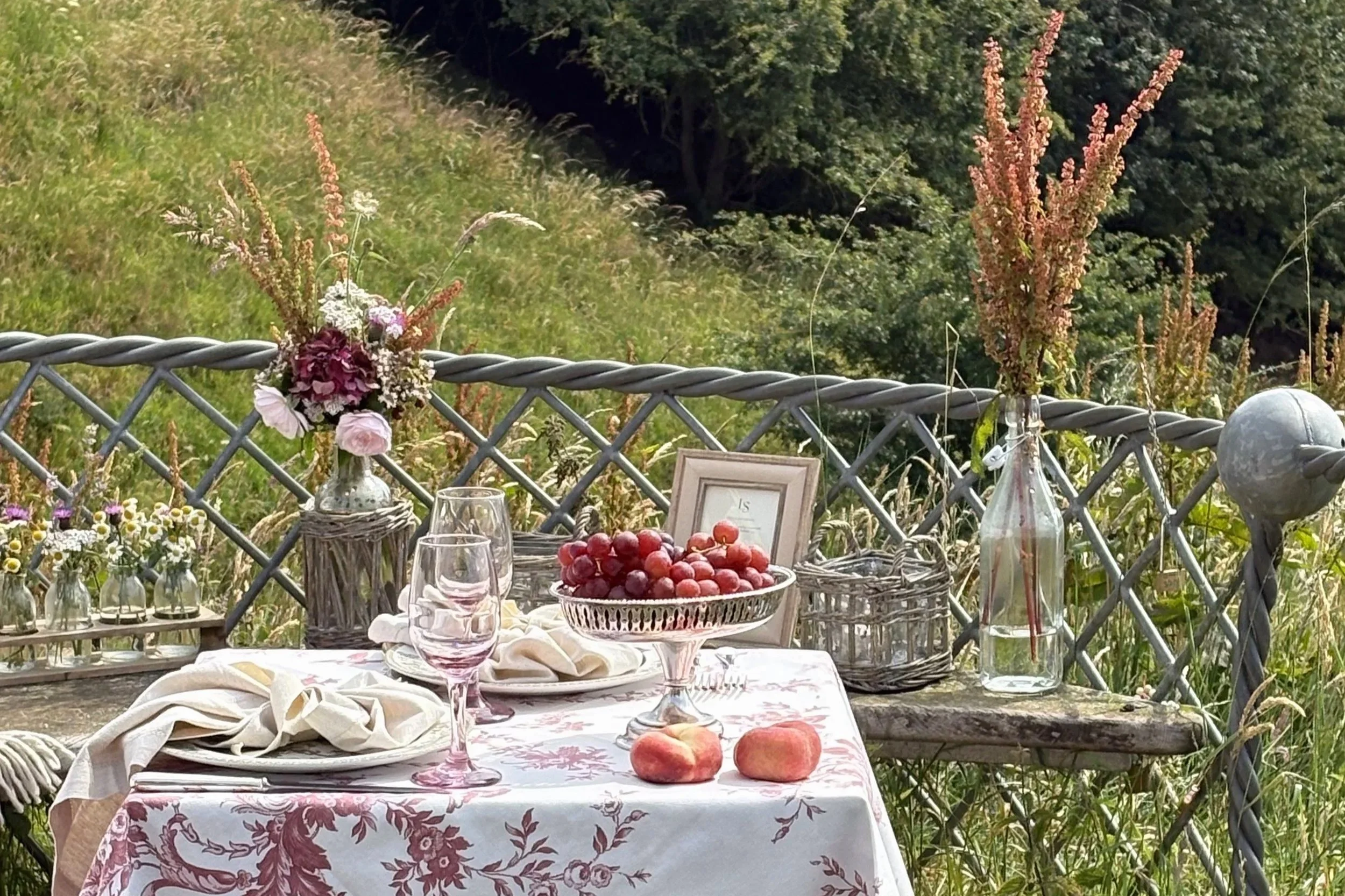 Heritage tableware, seasonal flowers and elegant tablescape by Laura Somborn overlooking the Royal Border Bridge in Berwick-upon-Tweed.