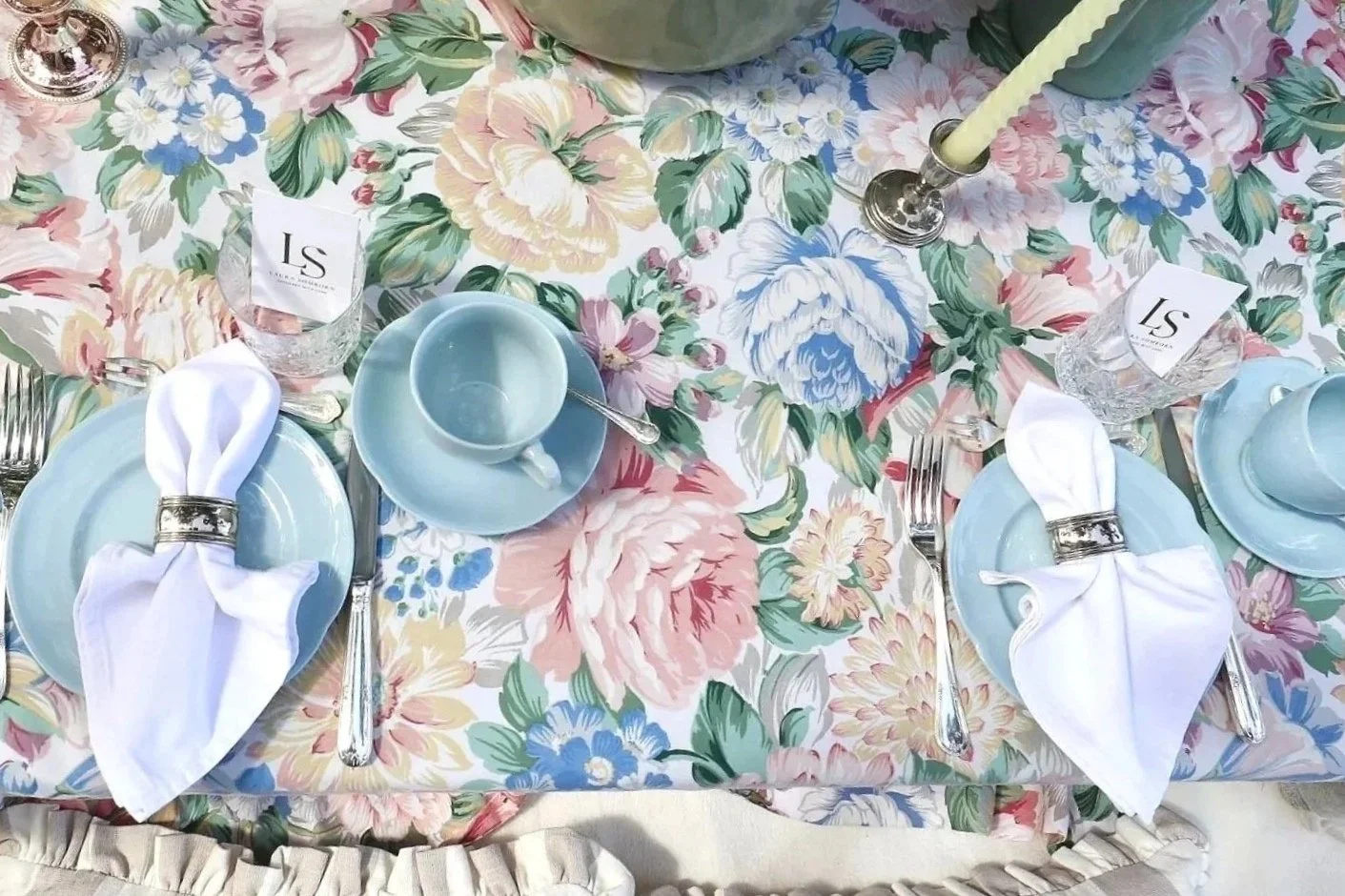 Heritage tableware, hand-folded linen napkins and vintage blue china styled by Laura Somborn for a bespoke tablescape at Norham Castle, Northumberland.