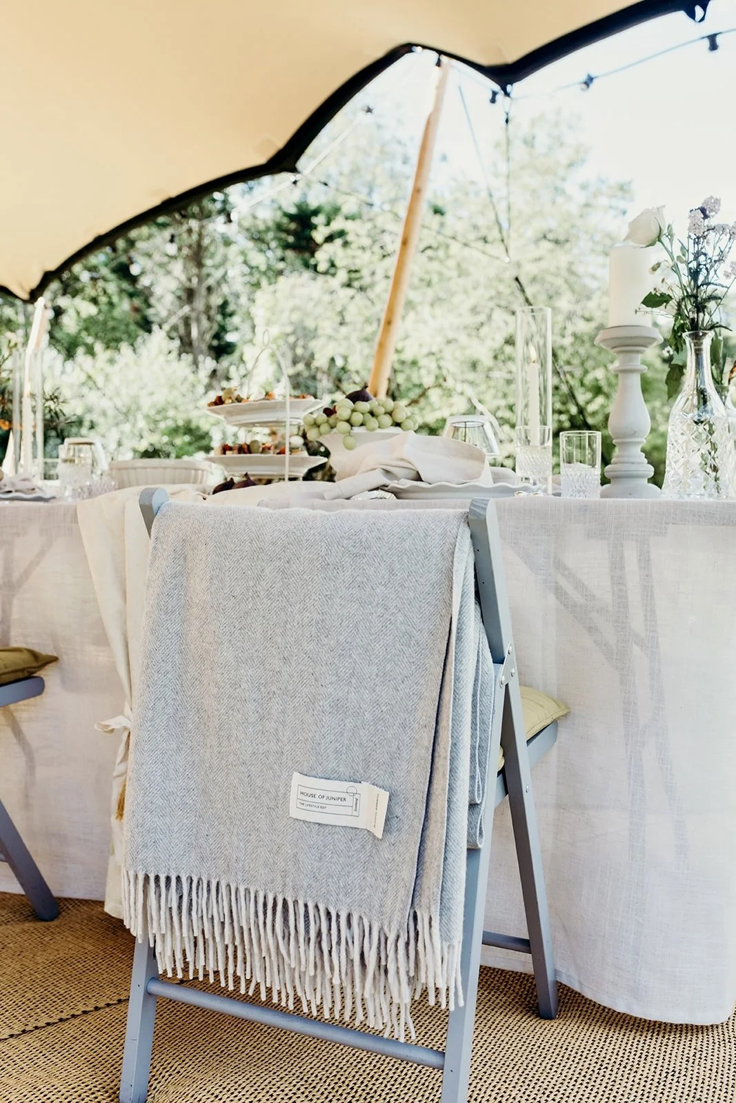 Indian summer table under tent with blanket.jpeg