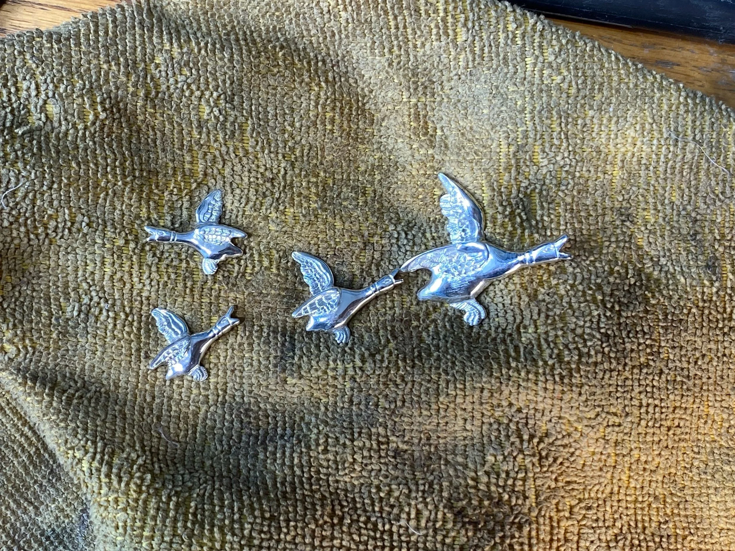 All cleaned and polished master versions ready for moulds to be made allowing me to create a necklace, cufflinks and the one-and-only 'Duckle Nuster'. 