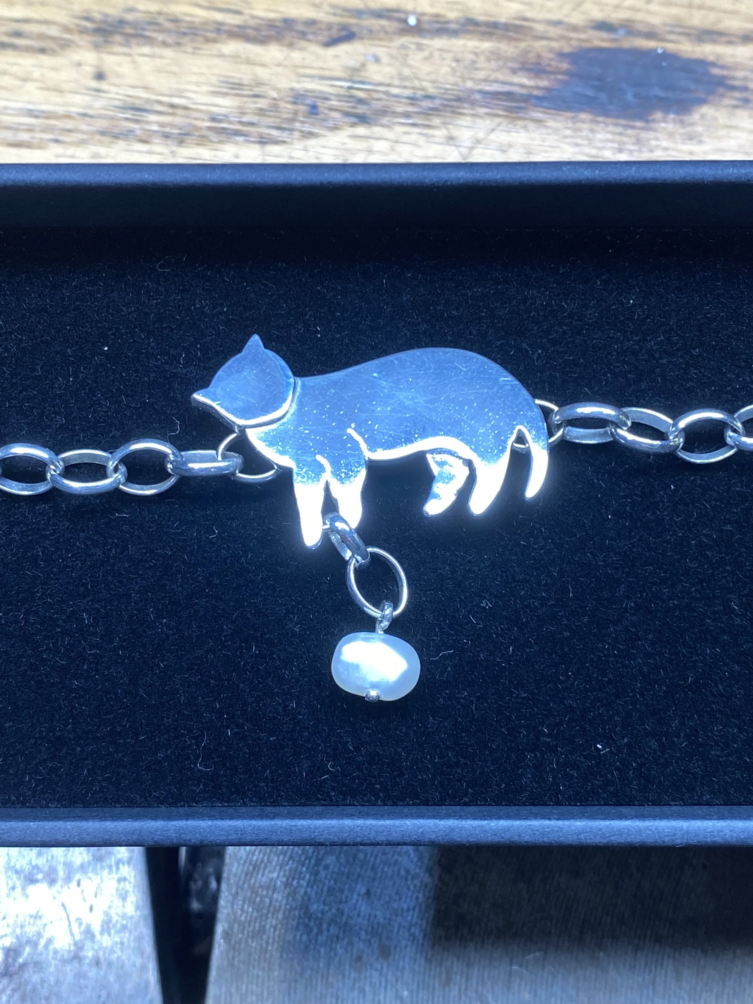 Detailed picture showing the different levels of sheet used to create depth to the bracelet. 