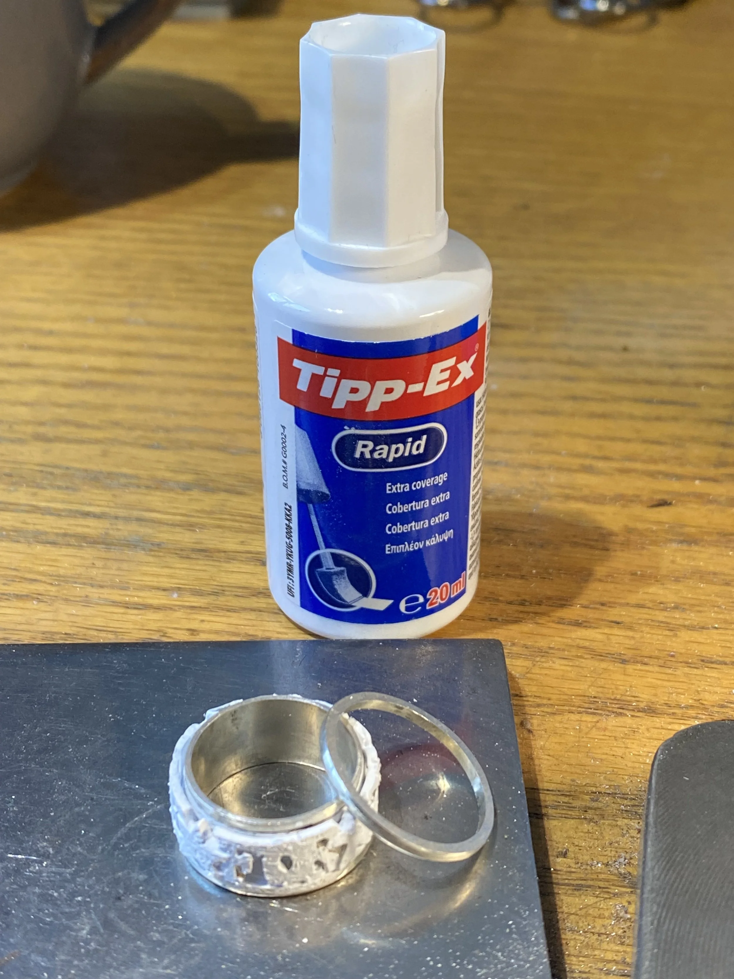 To stop the solder from flowing where you don't want it to, I cover the area in correction fluid or powdered rouge to act as a contaminant. This also works as a heat-barrier too! Simply wash it off after you have finished soldering.  