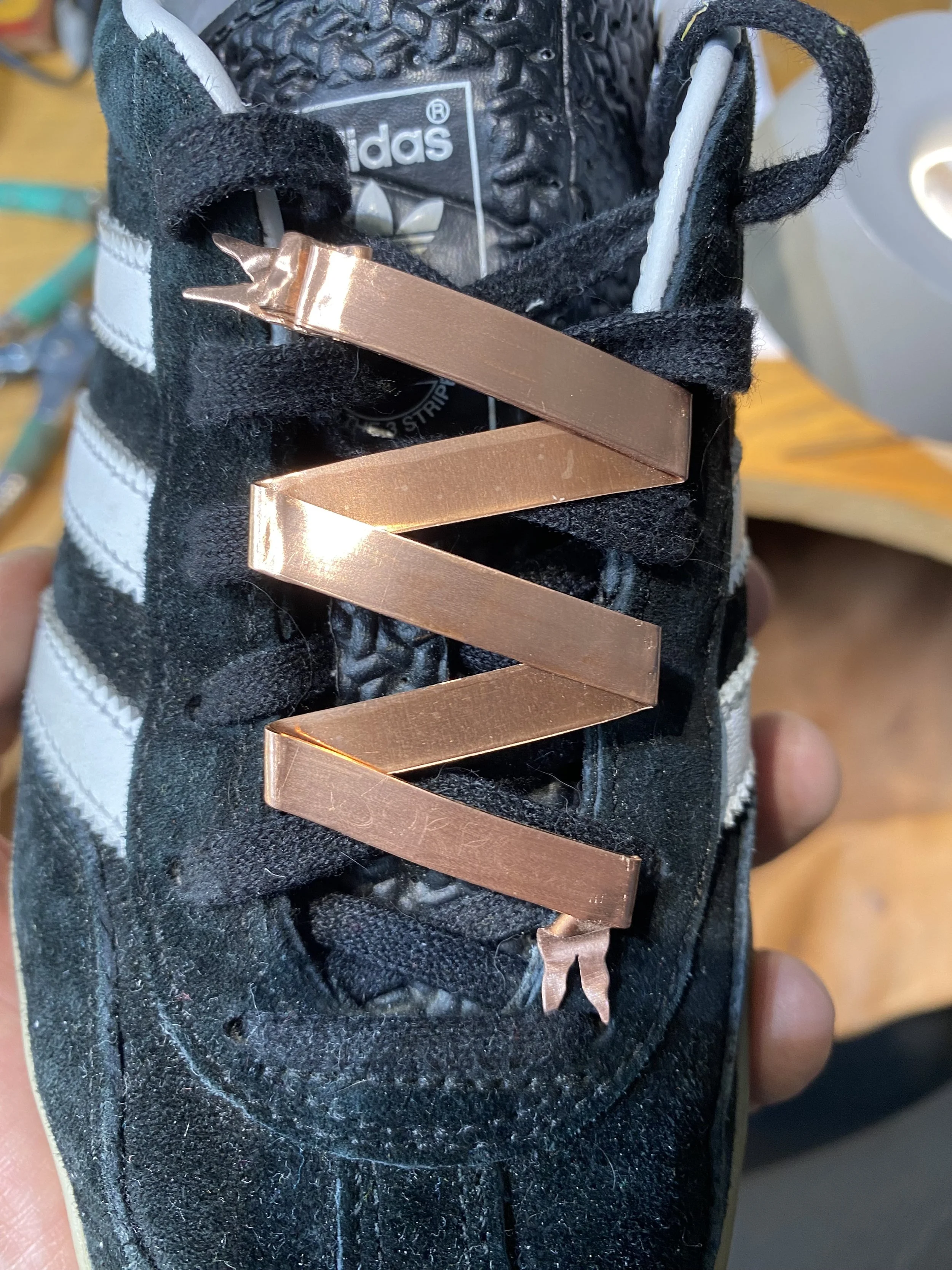 Good overall shape, but too long and will bend nearer the toes. Simplifying the design and aligning with the 3 stripes would look better! 