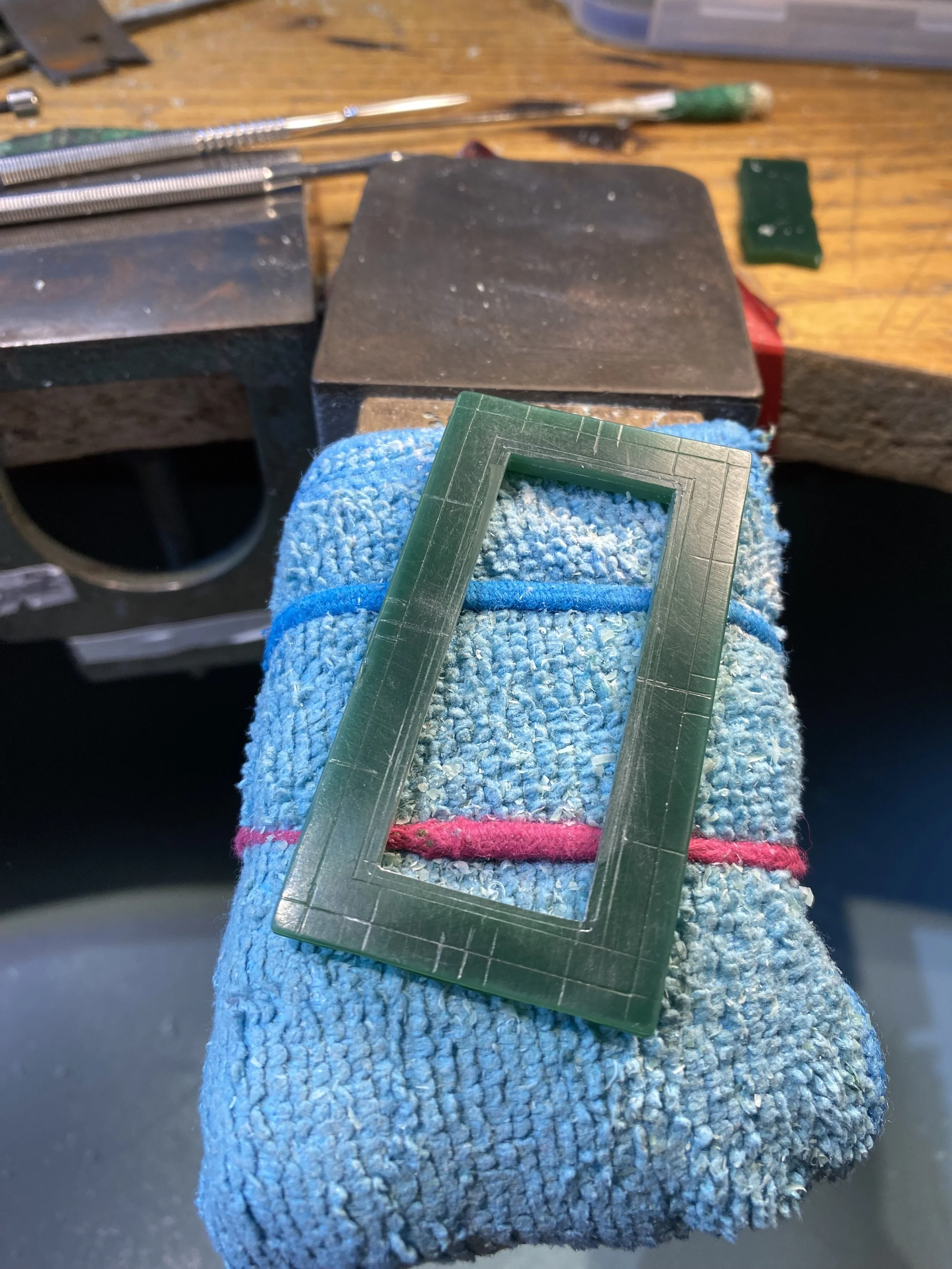 Flipped over the carving, calculated the size of the boarder and removed the centre. I did this at this stage to help give the carving some structural rigidity when mainly carving on the front. 