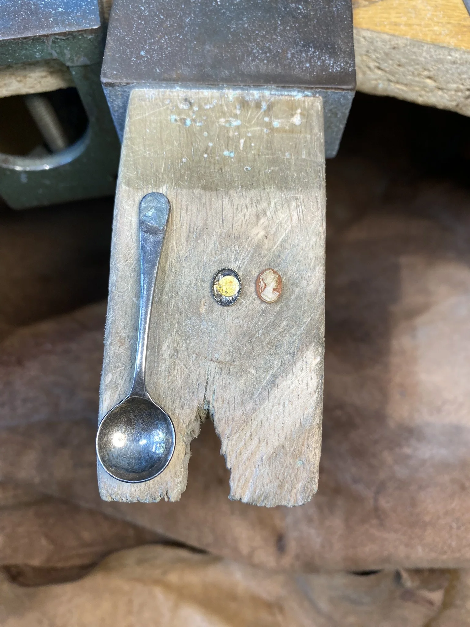 Removed the setting from the spoon and then the cameo from the setting. Thankfully the glue holding the cameo in had seen better days! 