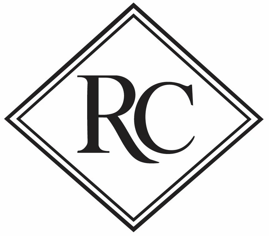 Roskell-Cheale Jewellery Stamp Logo. A black and white logo with the letters 'RC' inside a diamond shape with multiple border lines.