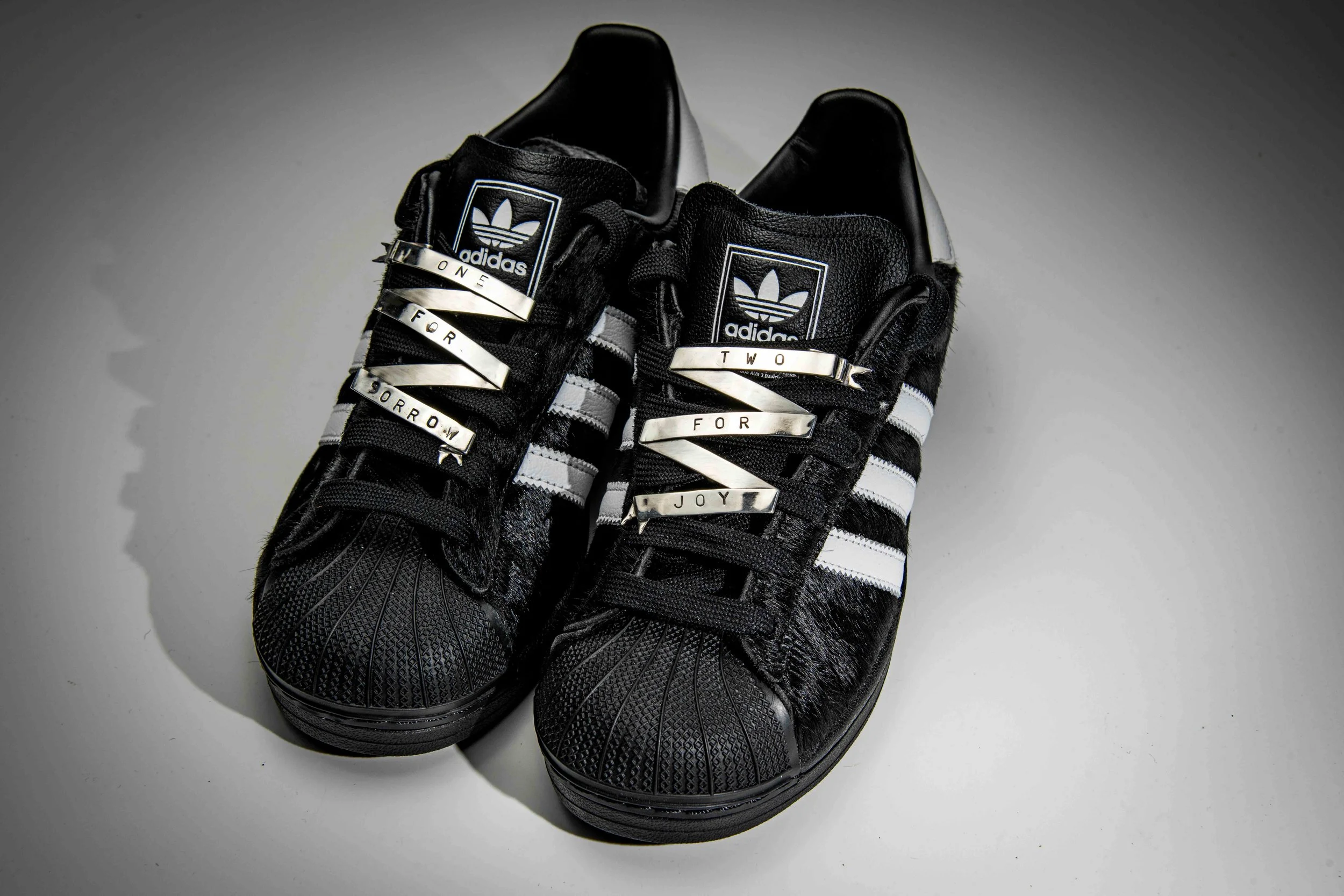 Fitted to a pair of Adidas Superstar II's in black Pony hair. 