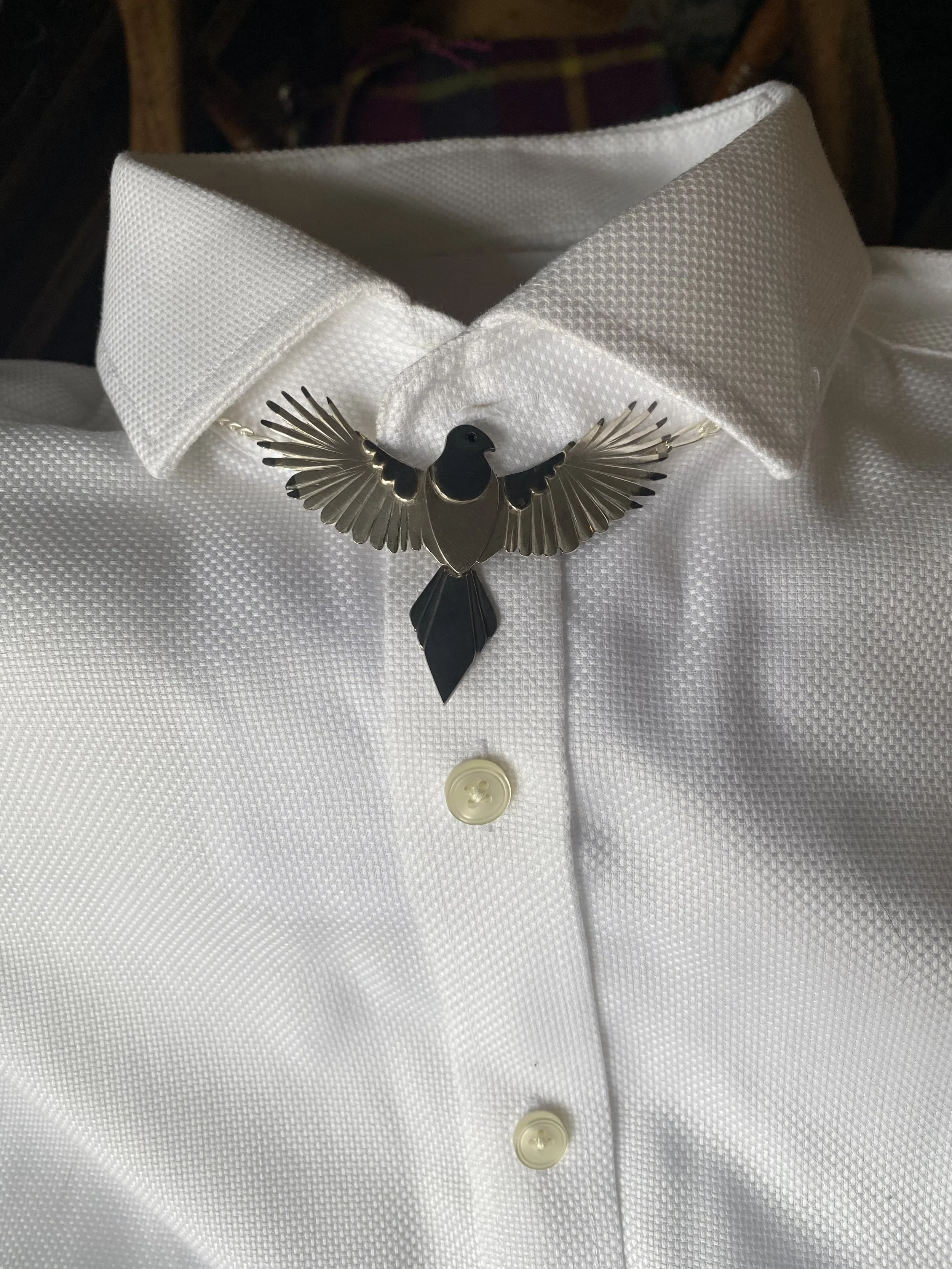 Mock-up shown on a white clip-collar shirt
