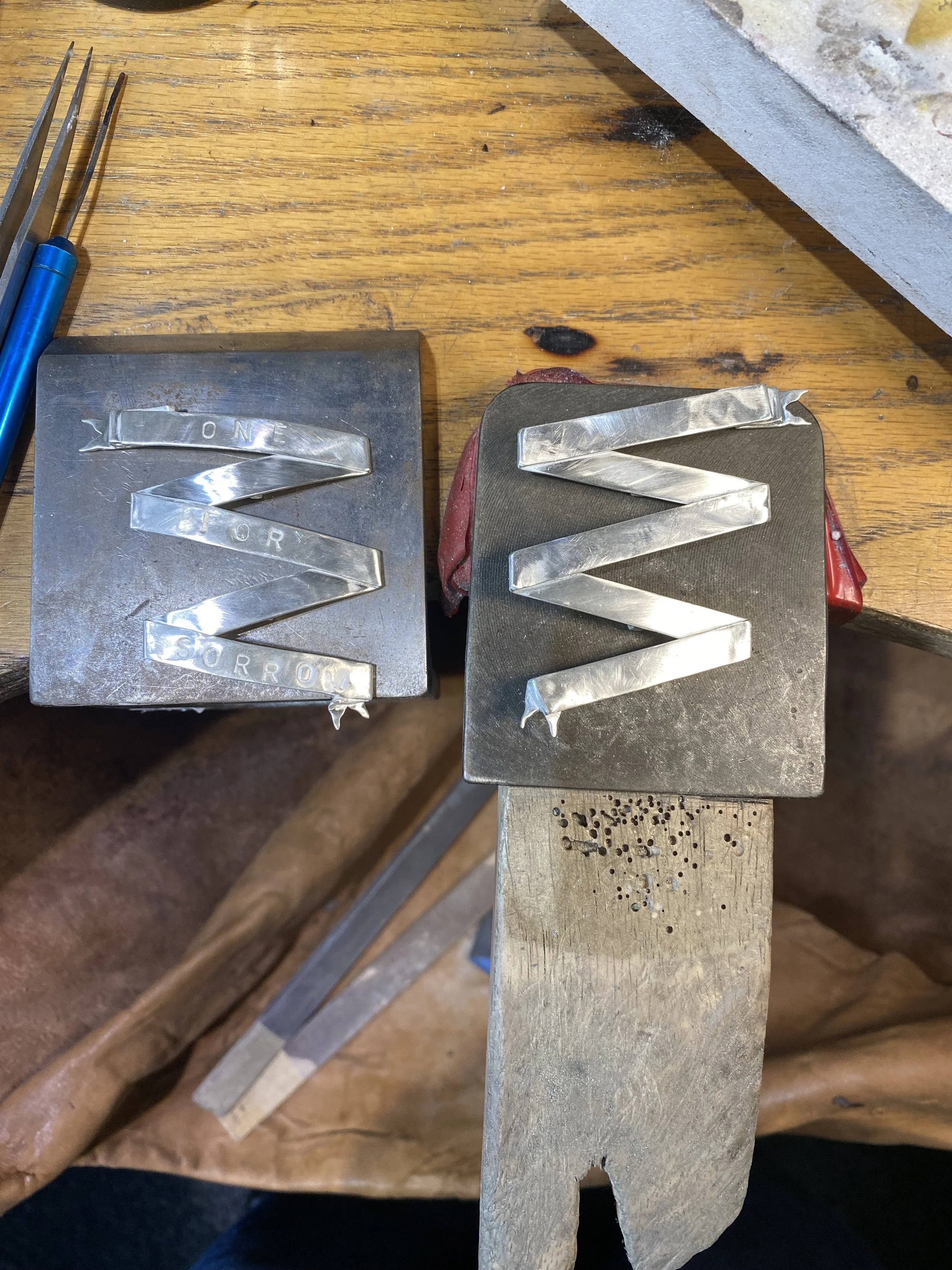 Recreated in sterling silver and hand punched the letting to add in a bit of Punk aesthetic! 
