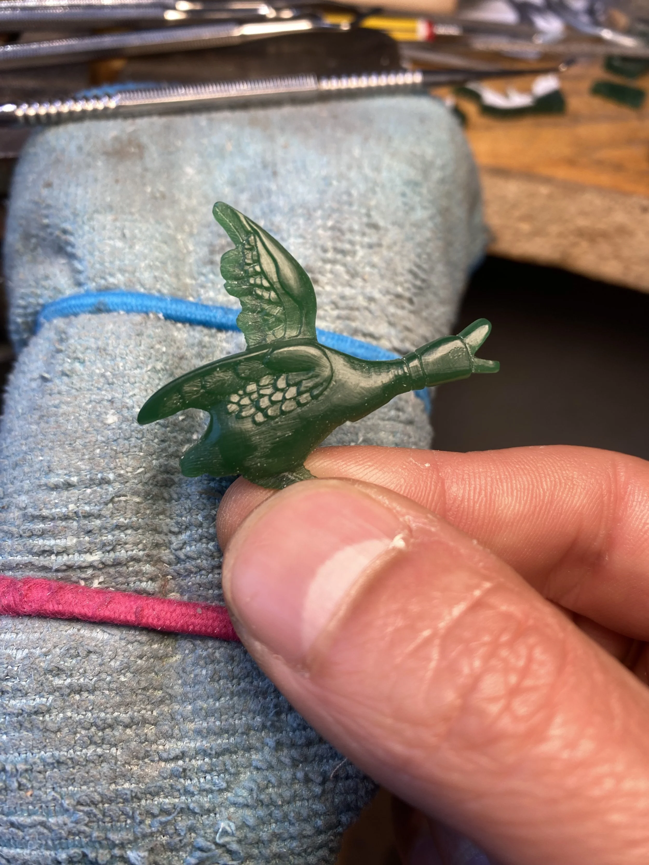 Keep carving the overall shape then move into the detailed areas. 