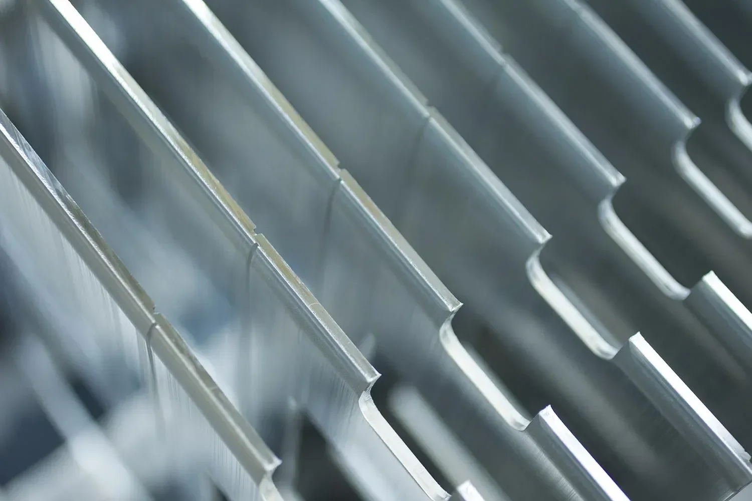 Close-up of metallic corrugated sheets, possibly used for roofing or siding.