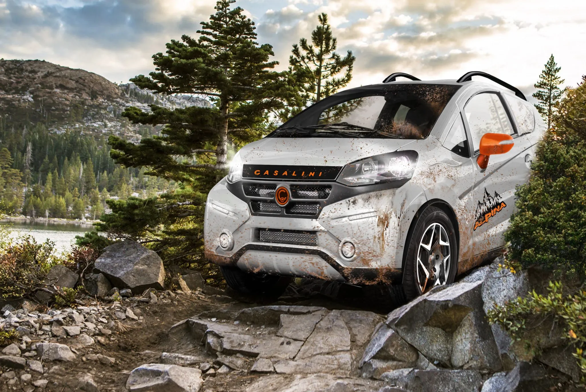 A white off-road vehicle with orange accents and dirt splatters driving through a rugged forested landscape with trees, rocks, and mountains in the background.