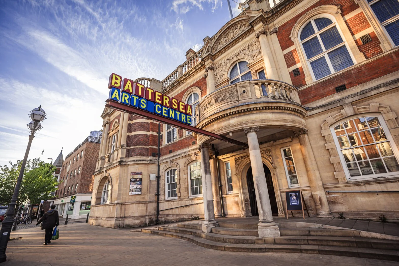 The illuminated Battersea Arts Centre sign above the entrance of the former Battersea Town Hall in Wandsworth