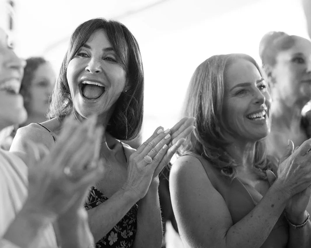 Group of women smiling and clapping in Hertfordshire at a private resisdents house for a jewish wedding