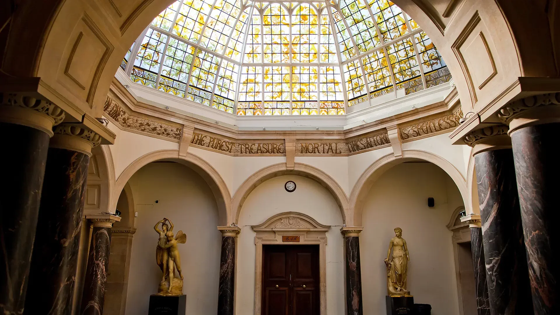 The Octagonal Hall at Battersea Arts Centre, with its stained glass dome, marble columns and gilded statues