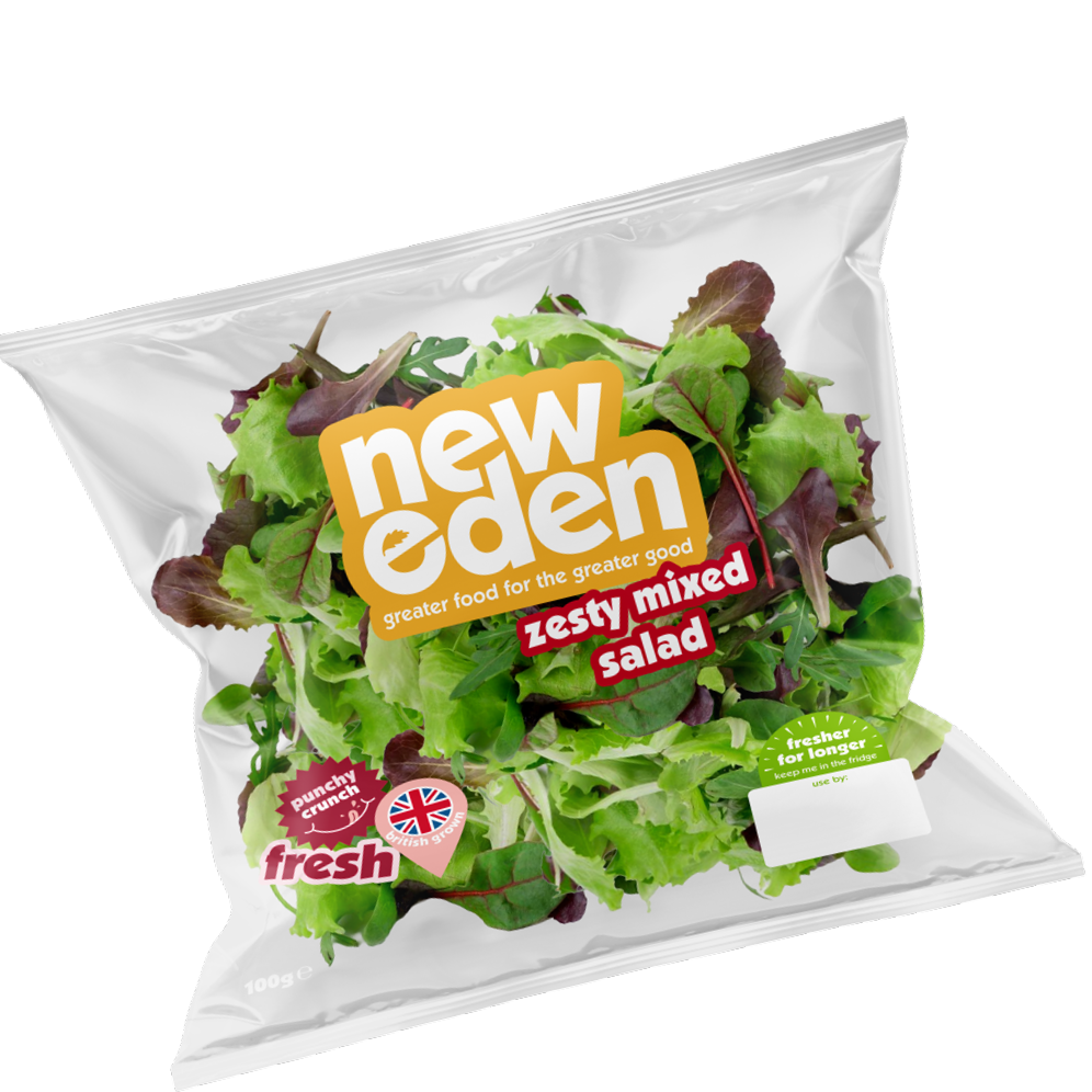 A bag of New Eden Zesty Mixed Salad with fresh mixed leafy greens. The packaging has labels indicating it is punchy and crunchy, fresh, and for longer storage in the fridge.