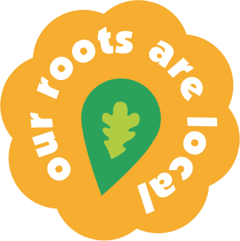 A logo with an orange flower-shaped background, white text that reads 'our roots are local' in a circular pattern, and a green map marker with an oak leaf inside at the center.