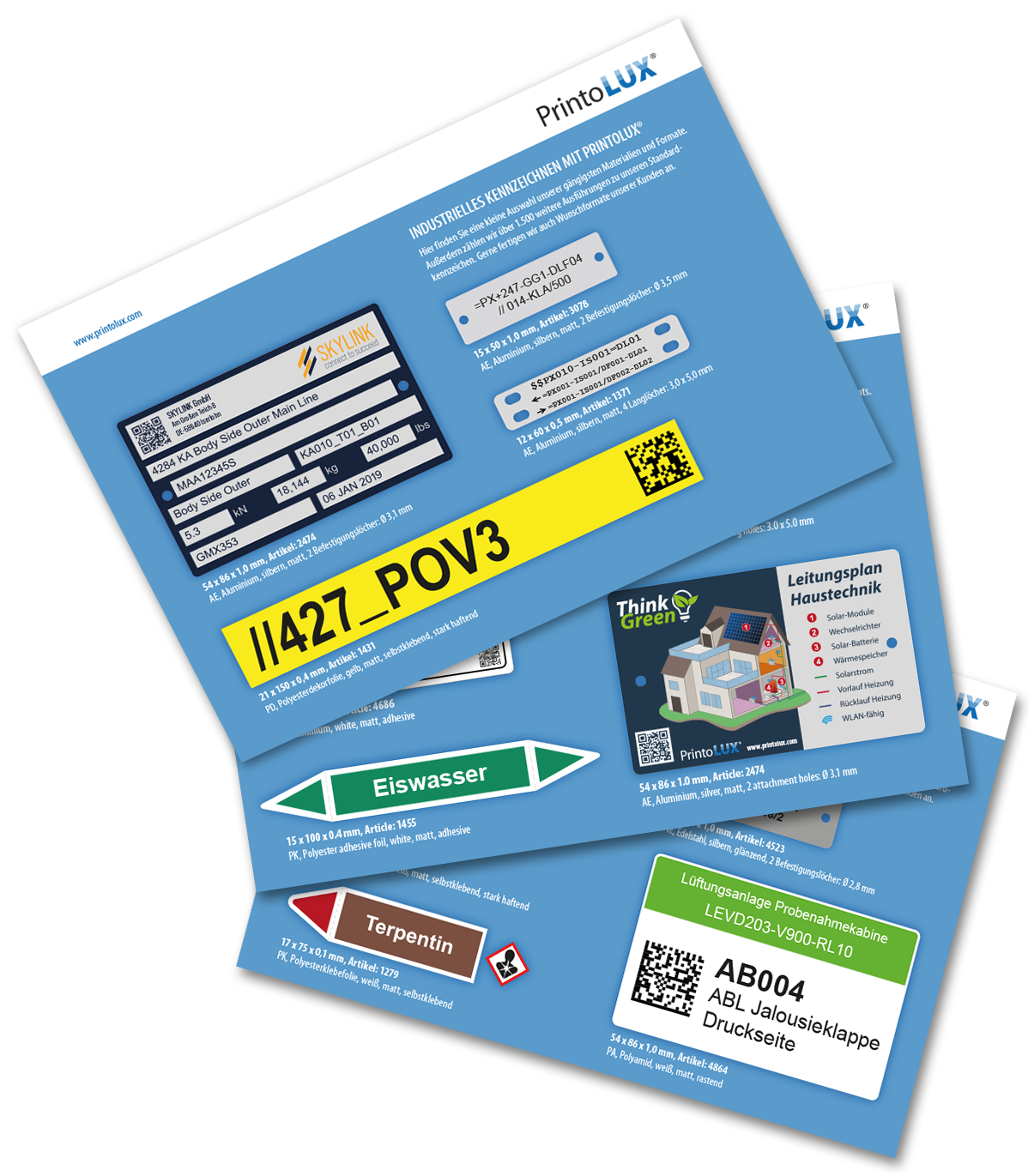 Collection of printolux printed labels samples and decals for industrial use, featuring various colors, text, barcodes, and QR codes.