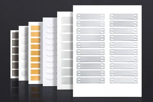 Collection of adhesive label sheets in various sizes and colors, including Metal, Silver, White and Brass.