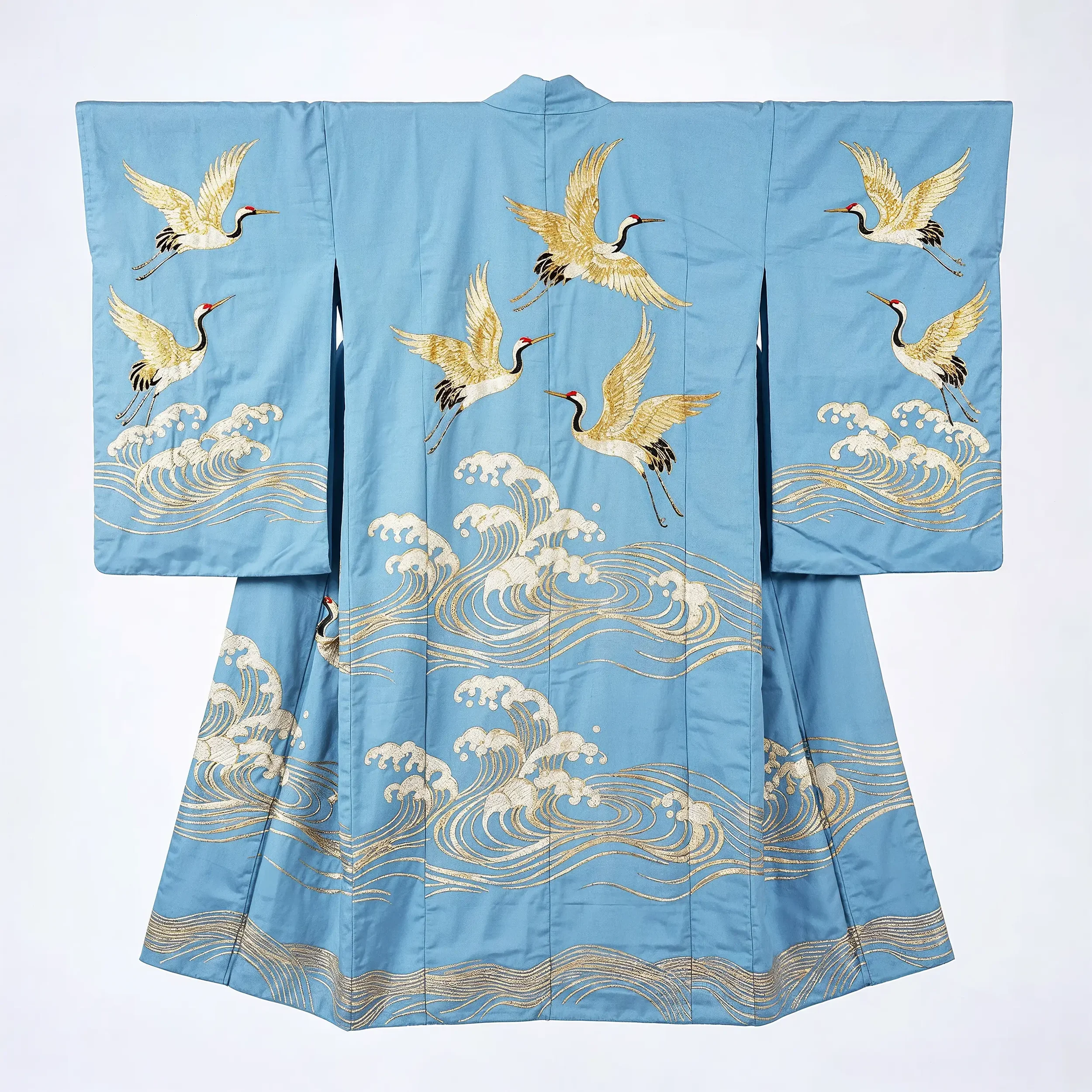 Light blue traditional Japanese kimono with embroidered white and black cranes and golden waves.