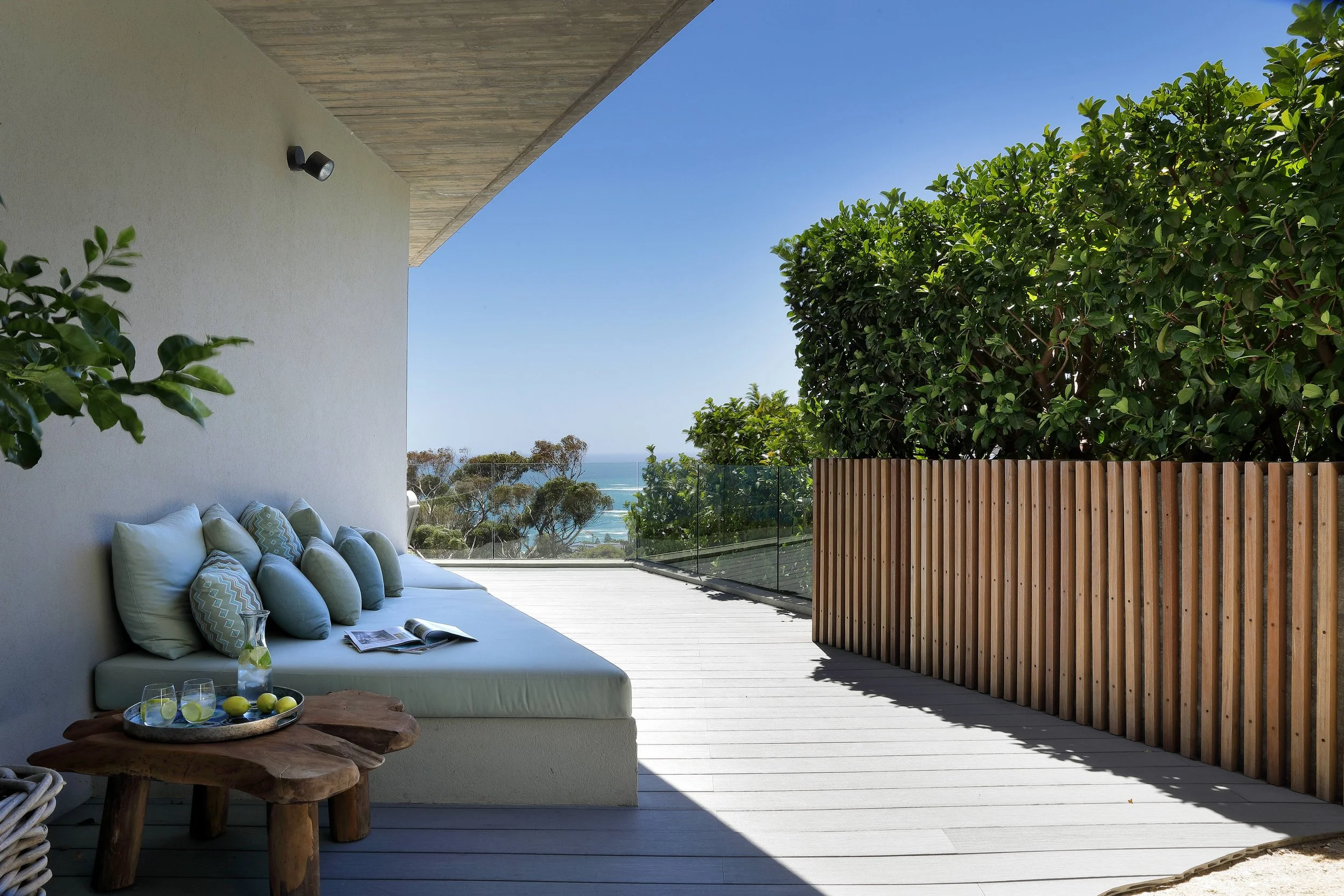 Modern concrete holiday home interior, outdoor living, Camps Bay Cape Town, designed by Anja Lehne | Fabliving