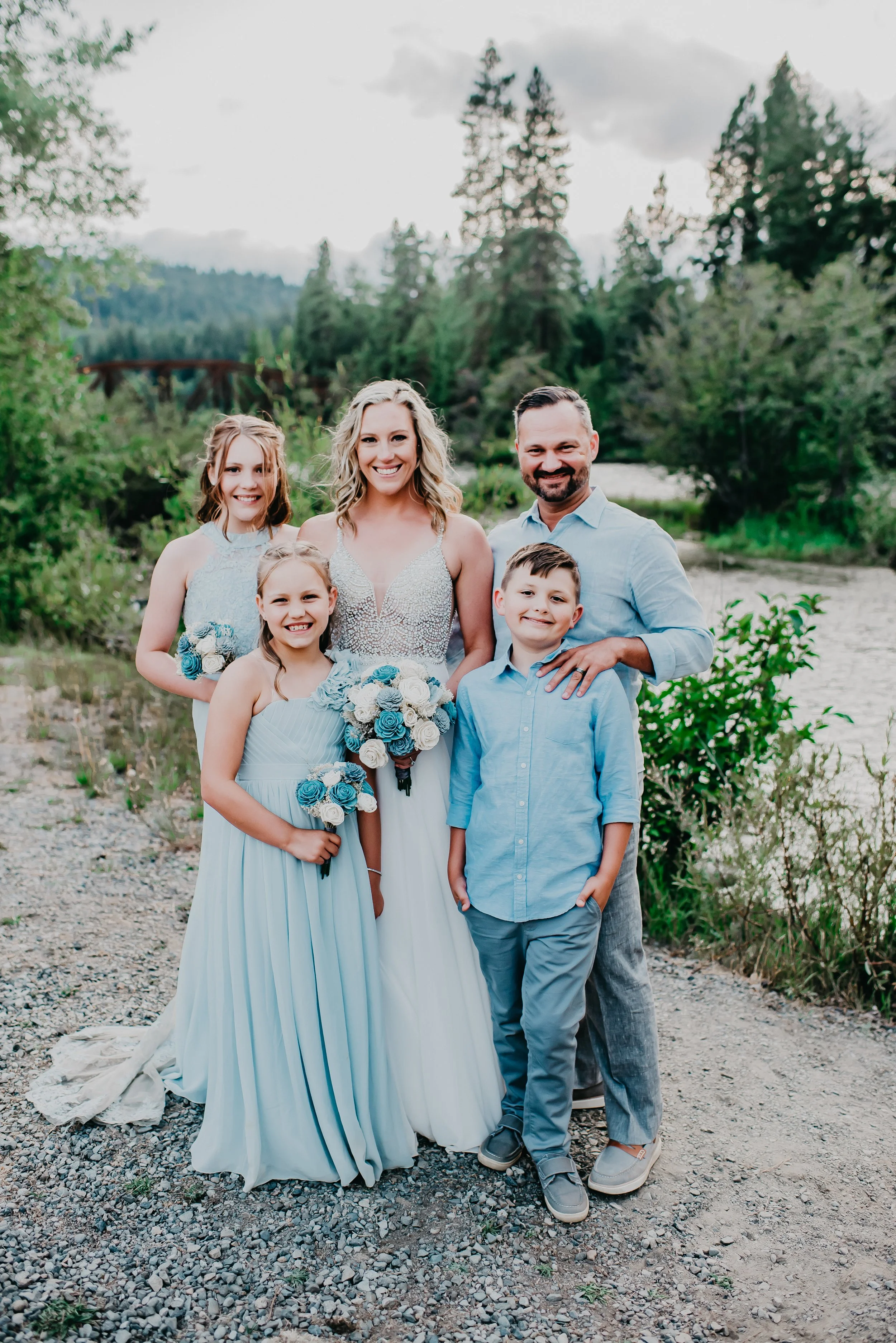 Mary Allison Jensen, LICSW, with her blended family at a wedding celebration outdoors in the Pacific Northwest — founder of A Legacy of Healing and generational healing architect.