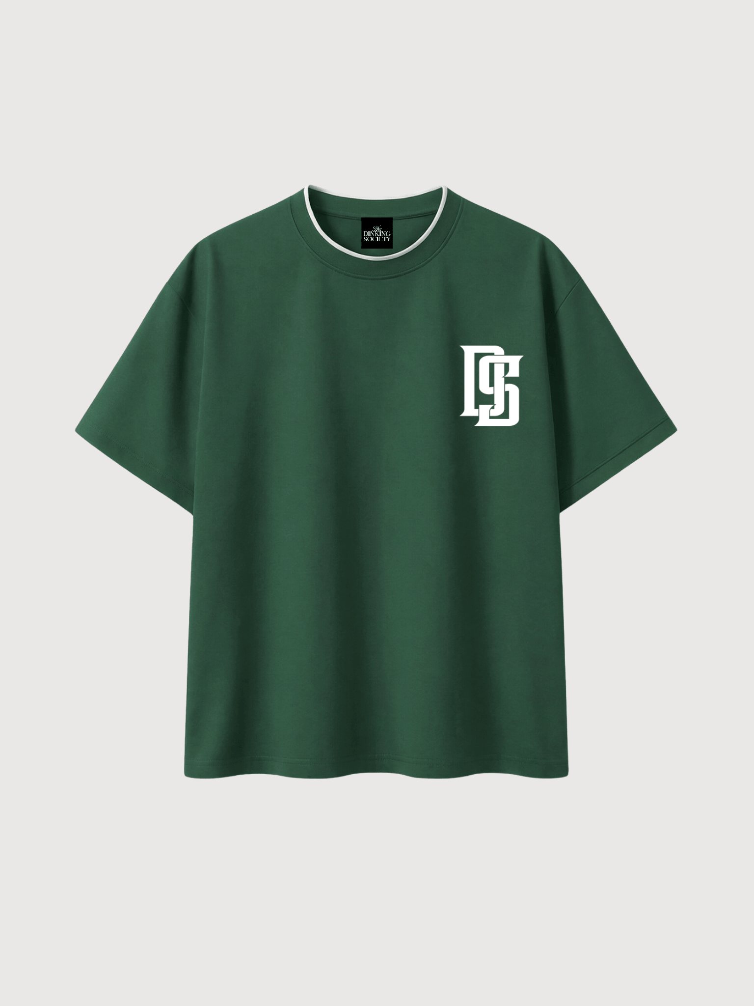 Front view of a luxury green pickleball t-shirt featuring the DS monogram logo from The Dinking Society.