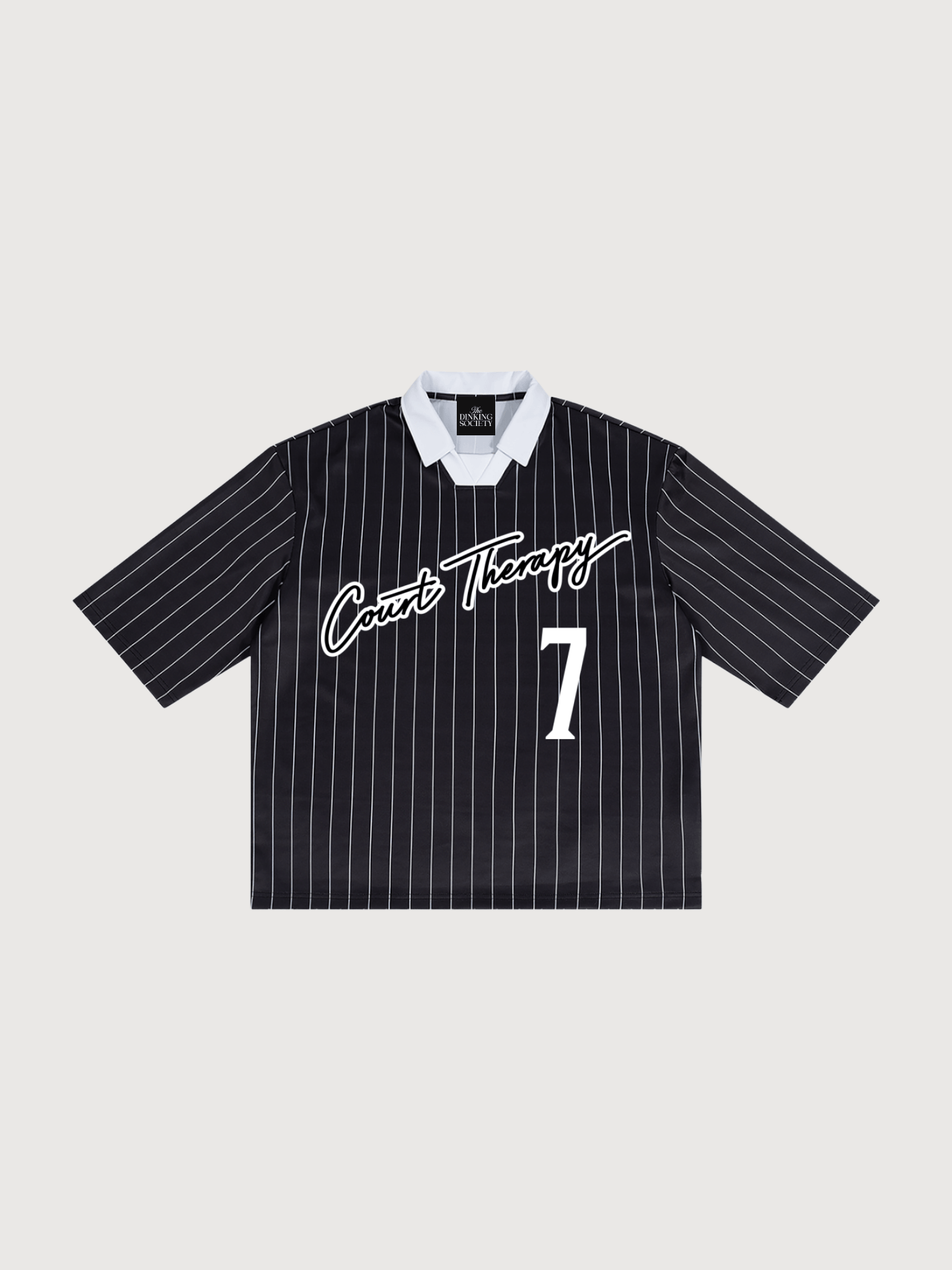 Front flat lay of The Dinking Society Court Therapy pickleball jersey in black pinstripe with white collar and athletic inspired number seven graphic.
