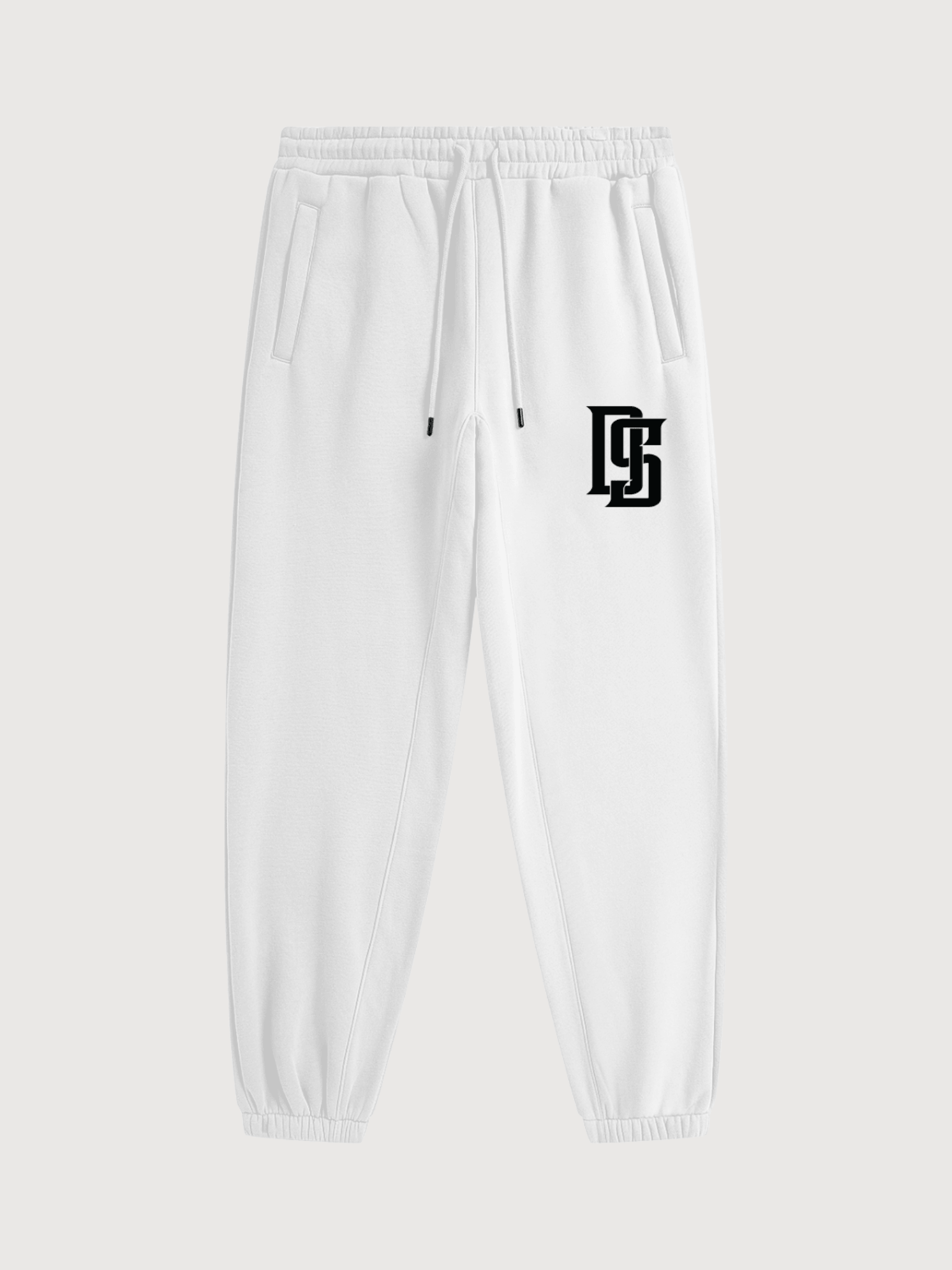 Luxury white jogger sweatpants featuring black DS monogram logo, elastic waistband, adjustable drawstrings, and tapered athletic fit.