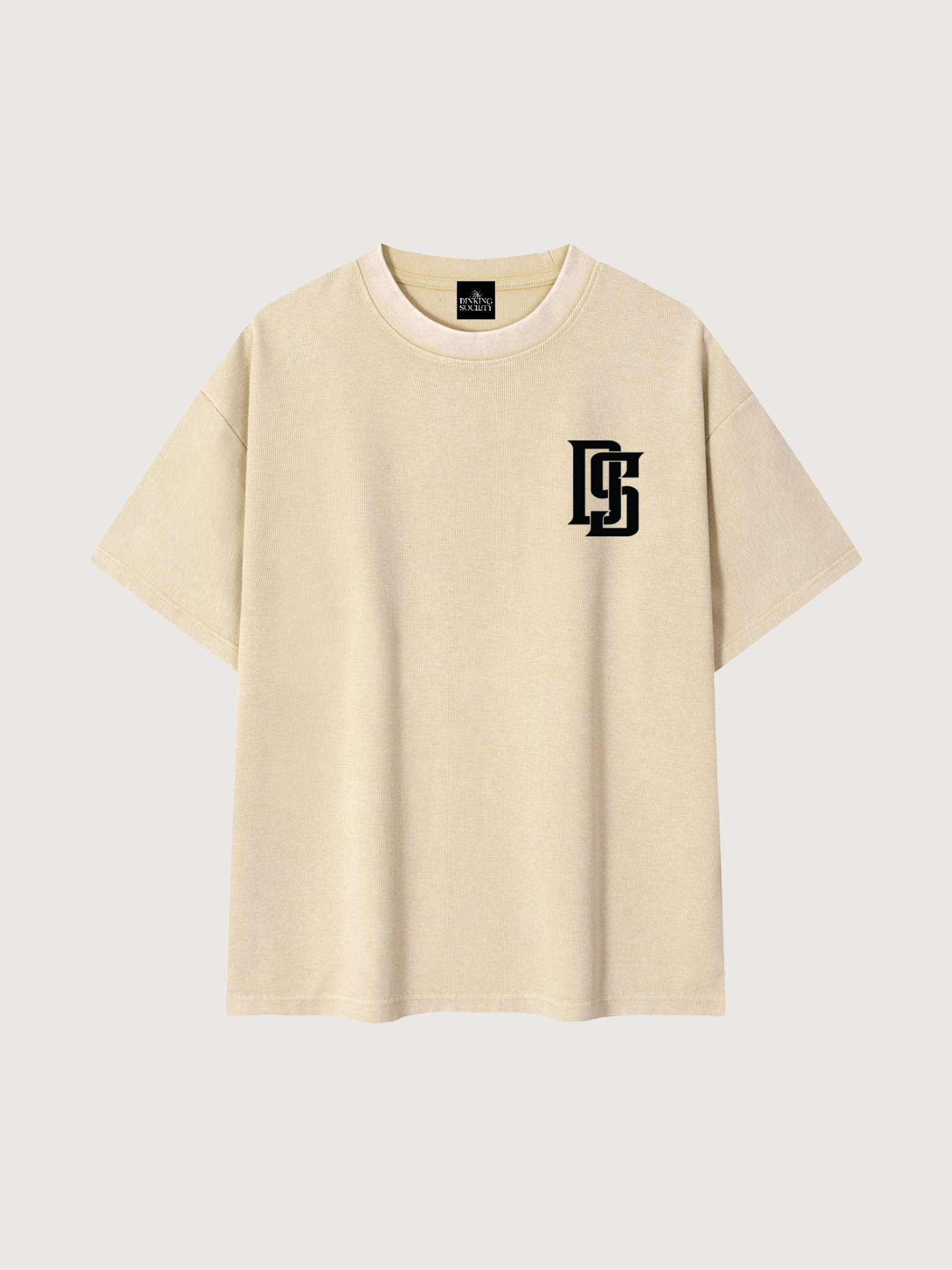 mens-beige-ds-monogram-pickleball-tee-front-flatlay.png