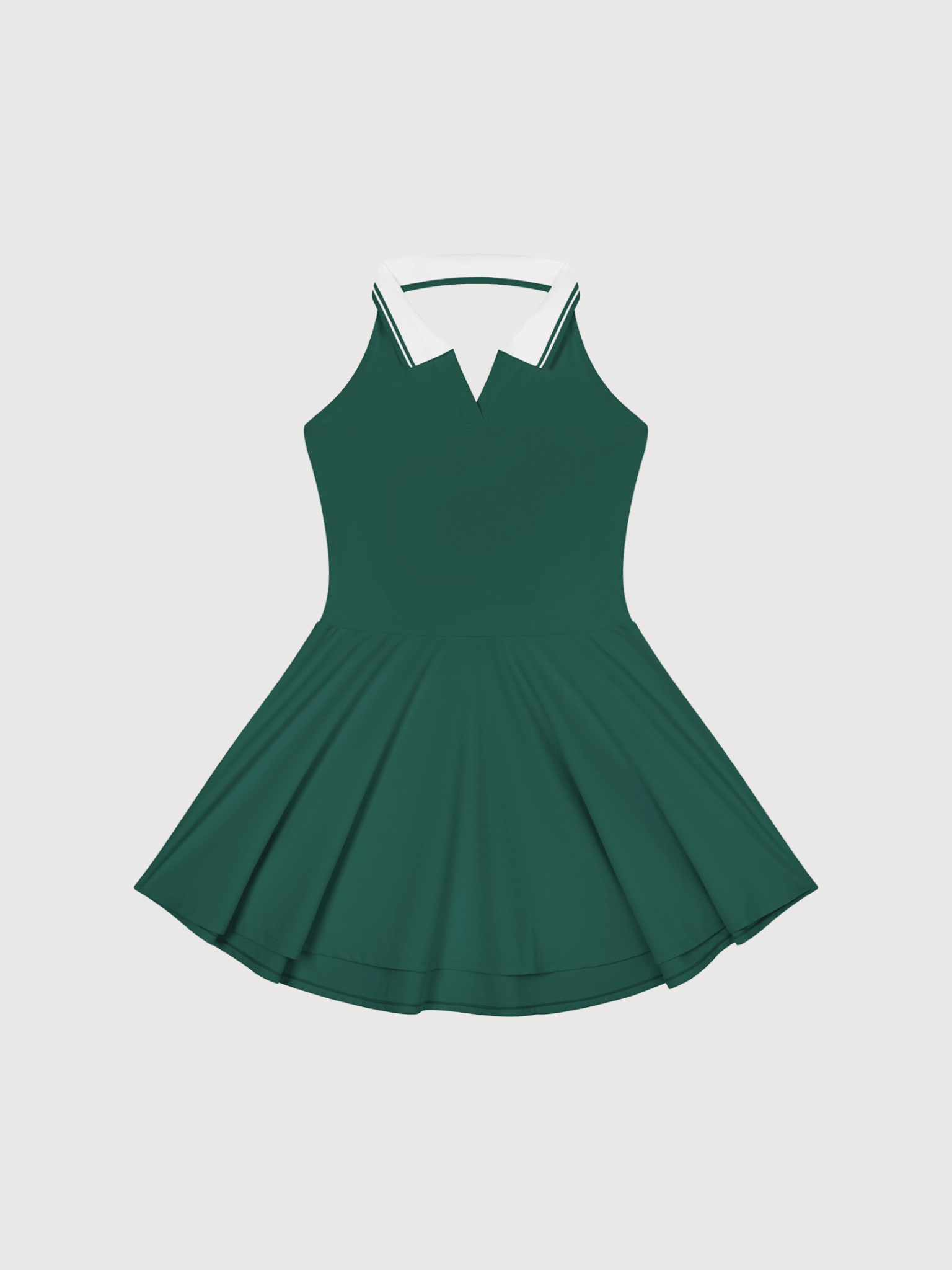 Front view of a luxury women’s green pickleball dress with white collar detailing from The Dinking Society.