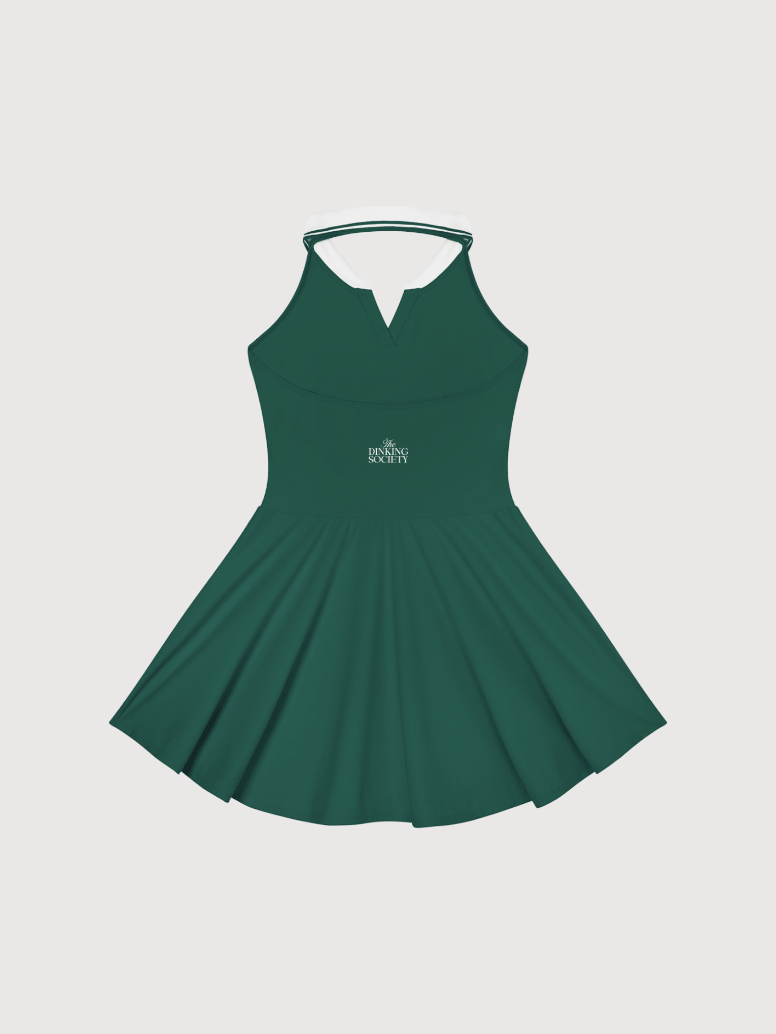 Back view of a premium women’s green pickleball dress featuring white collar accents and elegant athletic styling.