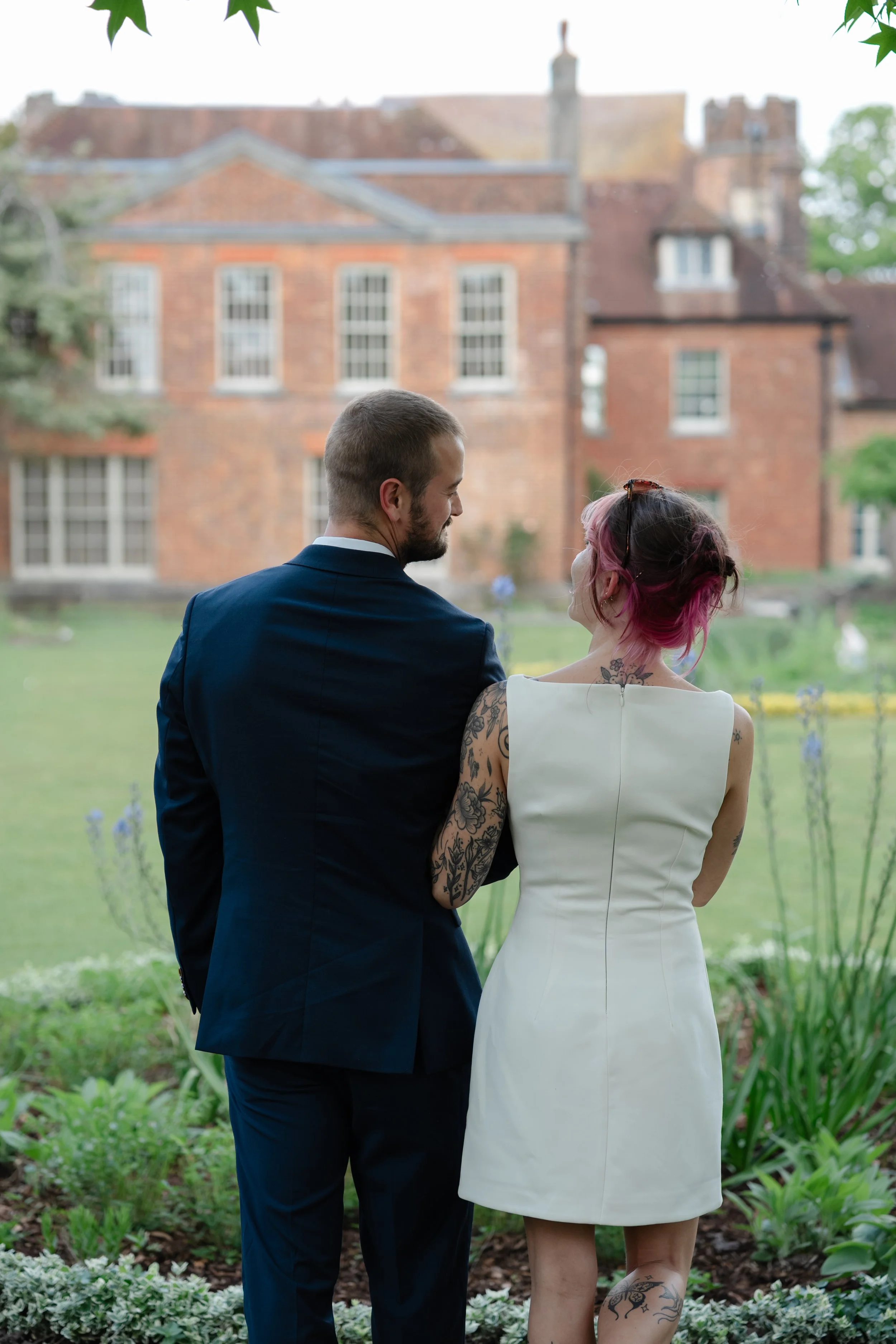 alternative-bride-tattoo-sleeve-manor-house-backdrop.jpg
