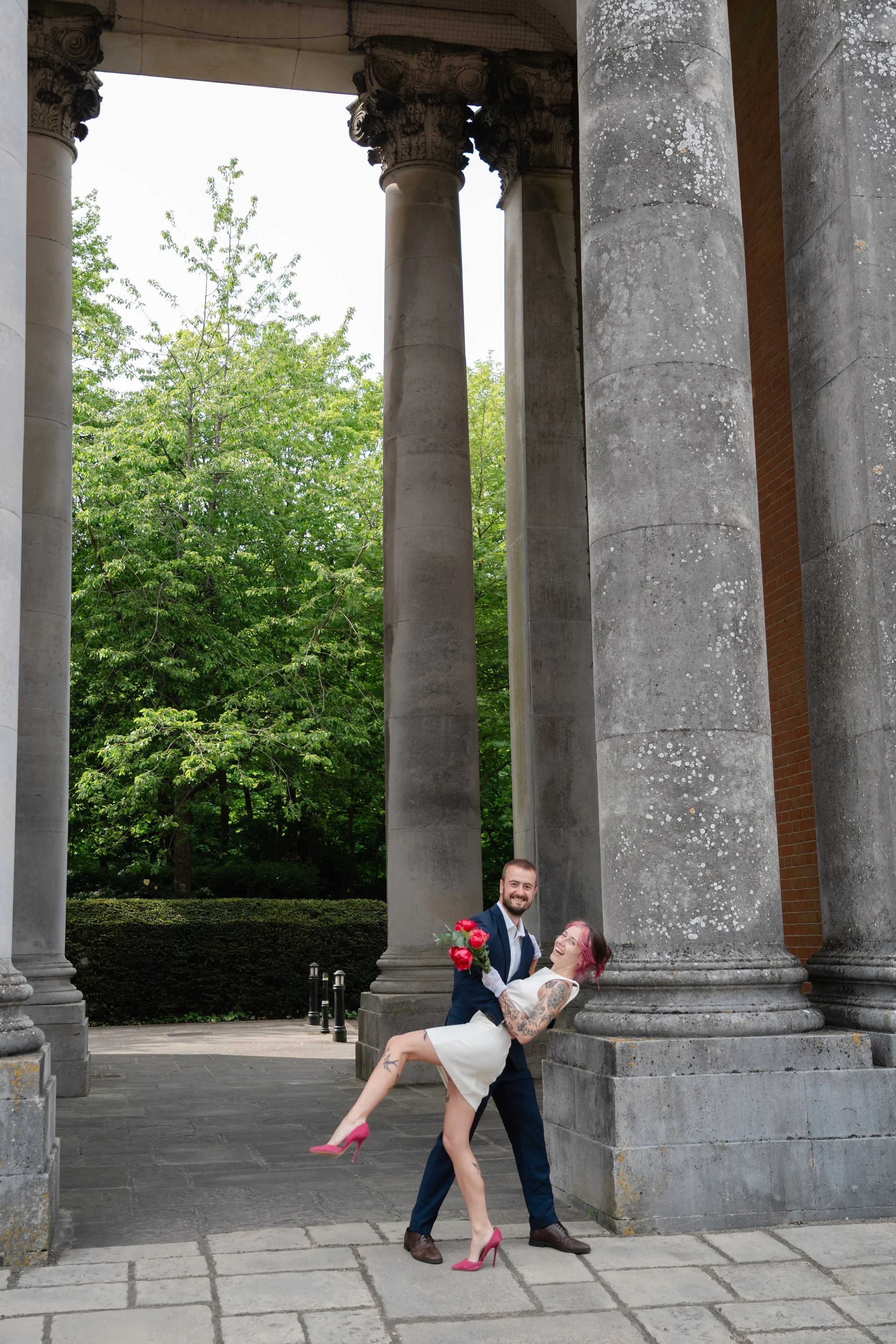 hampshire-wedding-photographer-couple-playful-dip-colonnade.jpg