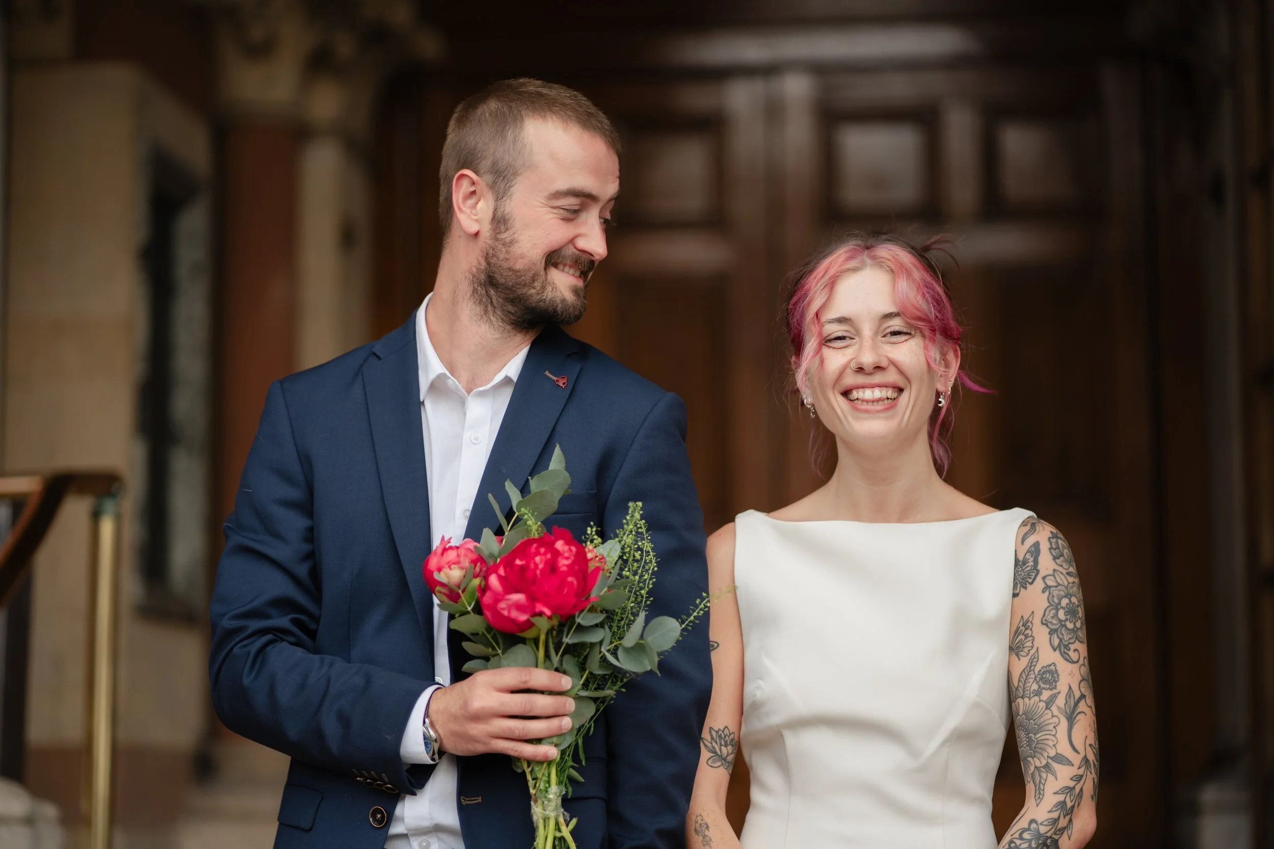 winchester-wedding-photographer-groom-admiring-bride.jpg