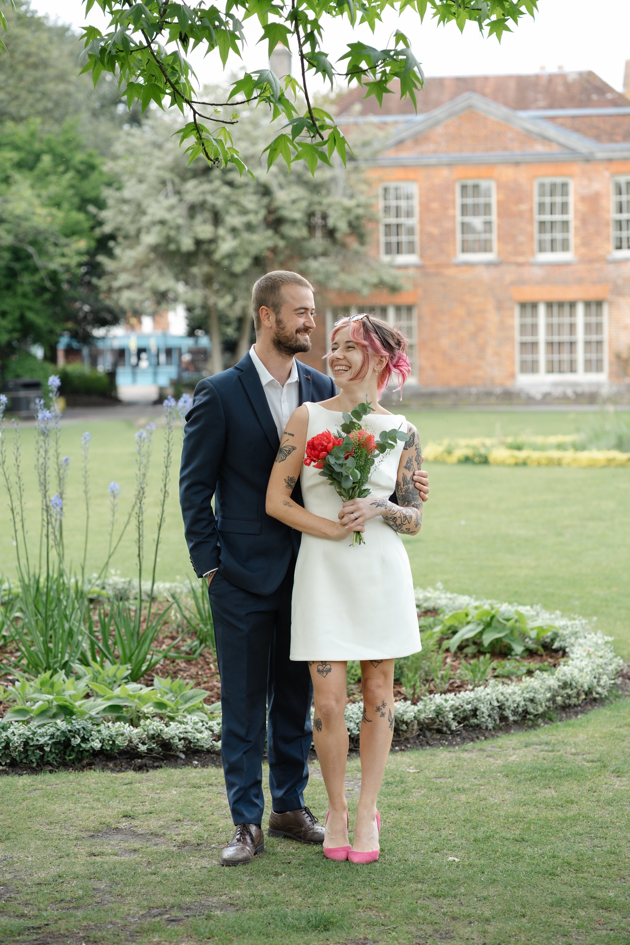 winchester-wedding-photographer-couple-smiling-garden-portrait.jpg