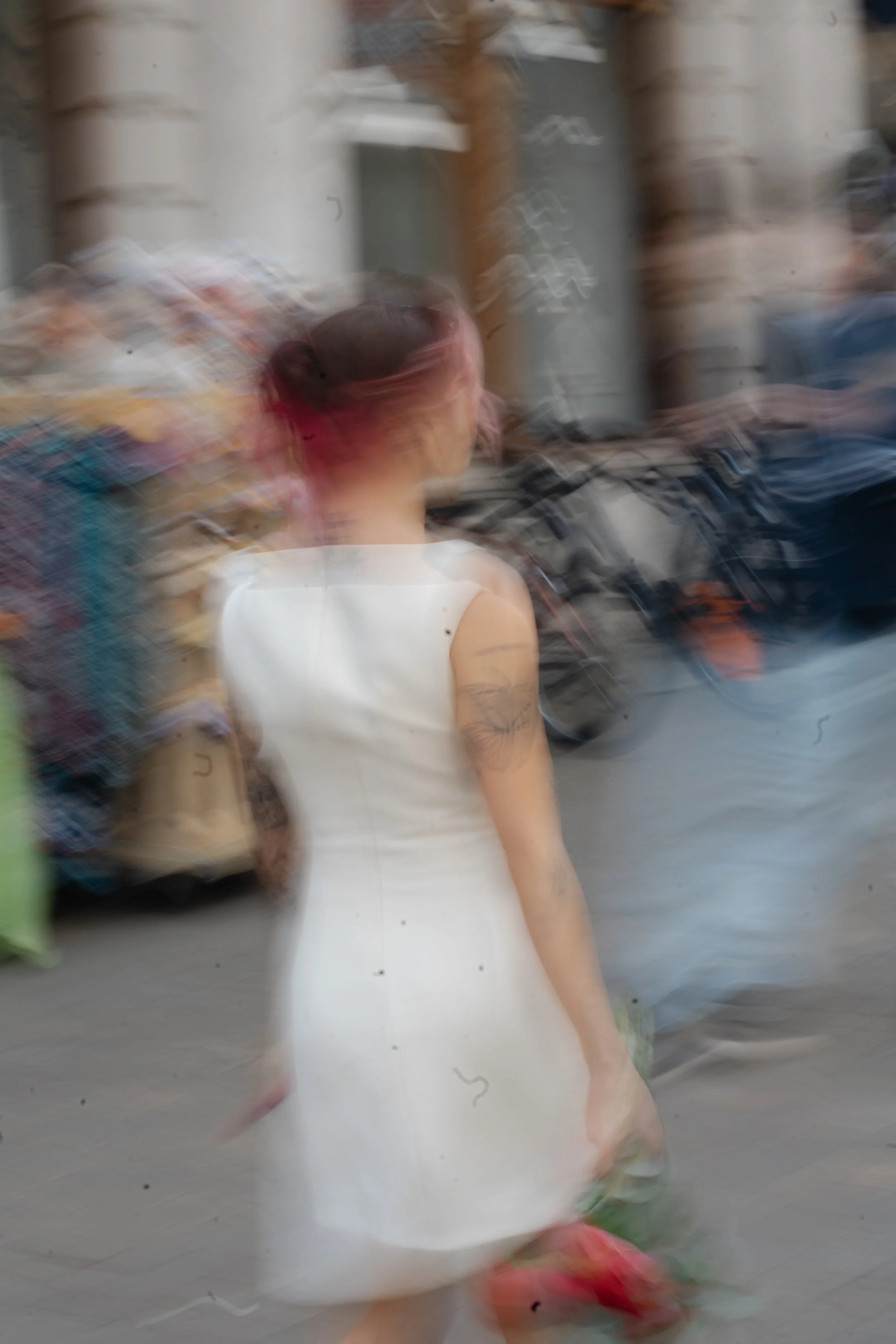 artistic-motion-blur-bride-walking-high-street.jpg